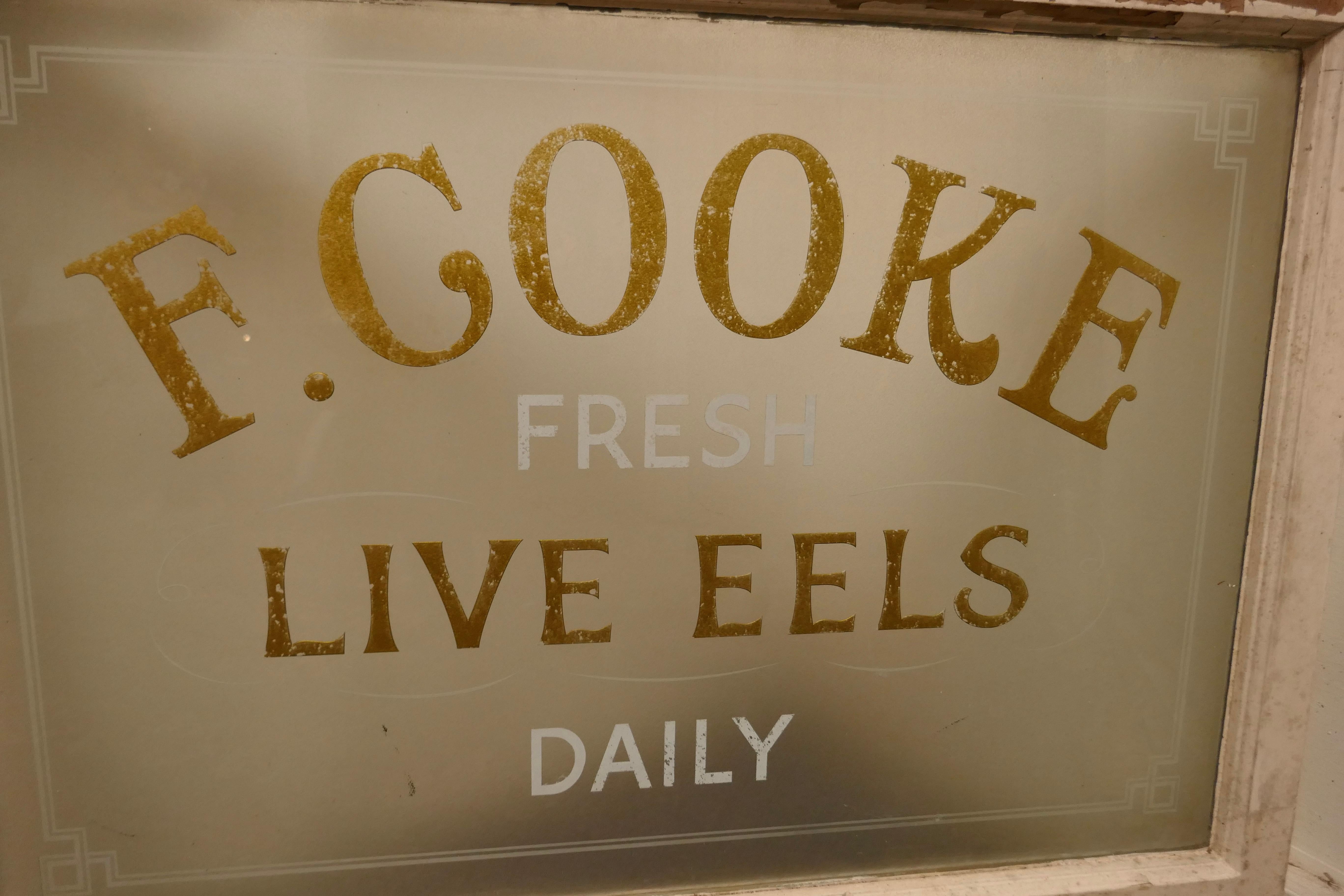 Live Eel and Pie shop window, Etched glass advertising sign

A great piece of social history, the window is the old sash type, the glass is etched and painted in gold and white and come from F Cooke
The frame is in sound condition but could do