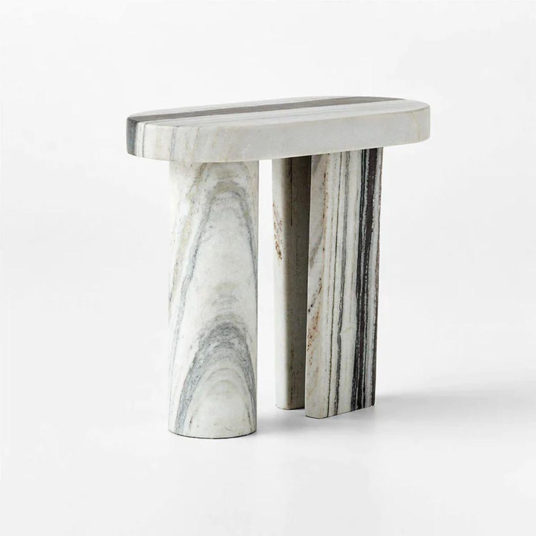 The Livello White Marble Side Table is a pristine example of timeless elegance and minimalist design. Crafted from high-quality white marble, it embodies the essence of sophistication and versatility. The pure white marble exudes a sense of luxury