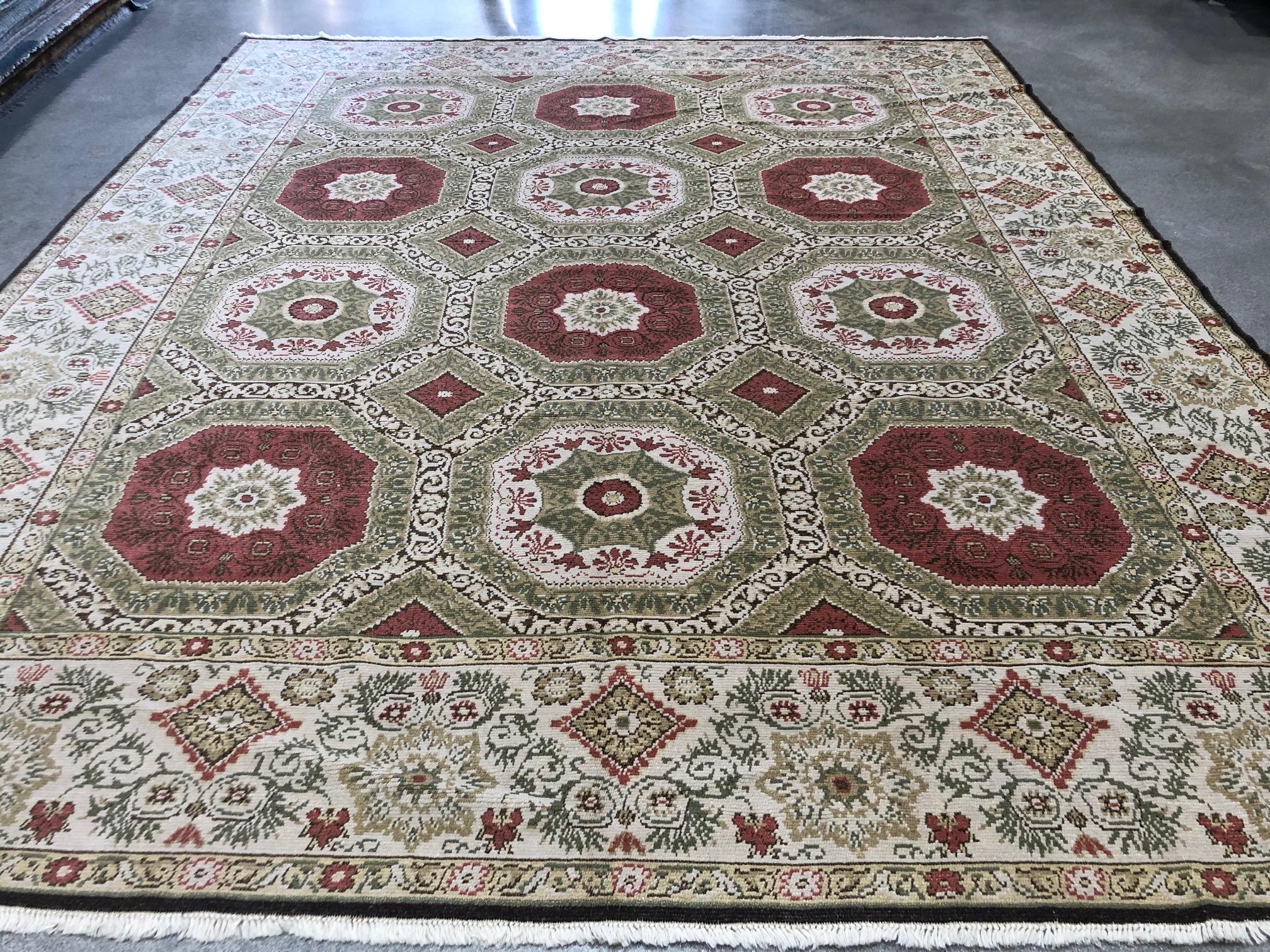 Geometric shapes and a charming floral pattern combine to create an enchanting area rug with coral, beige, gold and green tones.