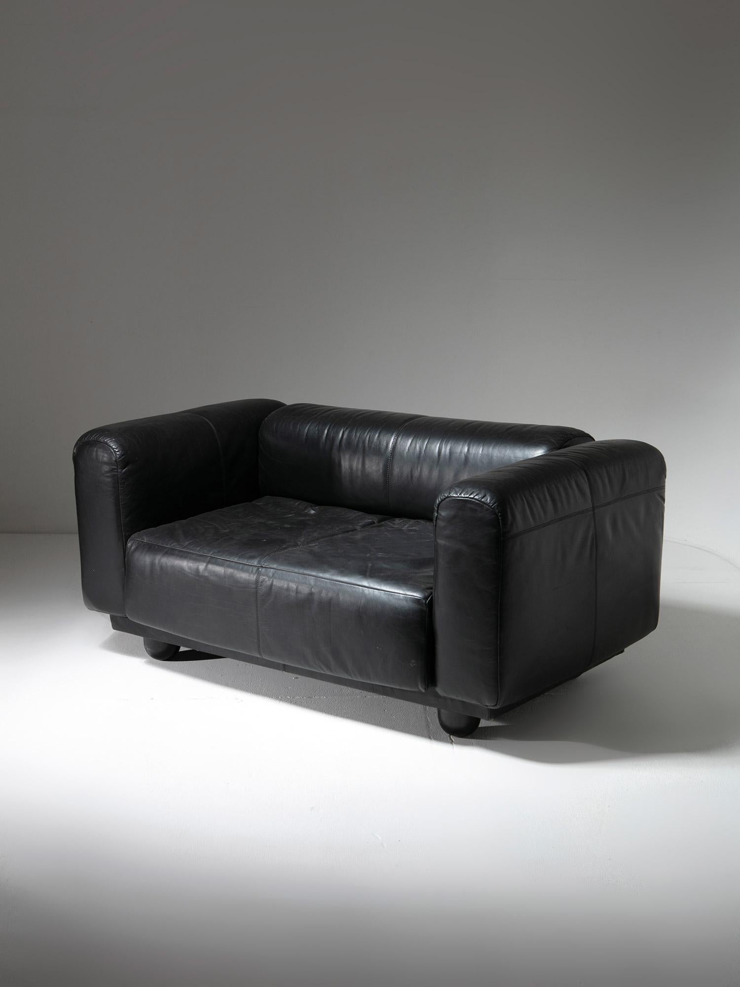 Living settee by S.L. Bensinger and Claude Verm for Costi.
Four squared leather covered blocks on a wood base with round feet. 
Also available a matching armchair.