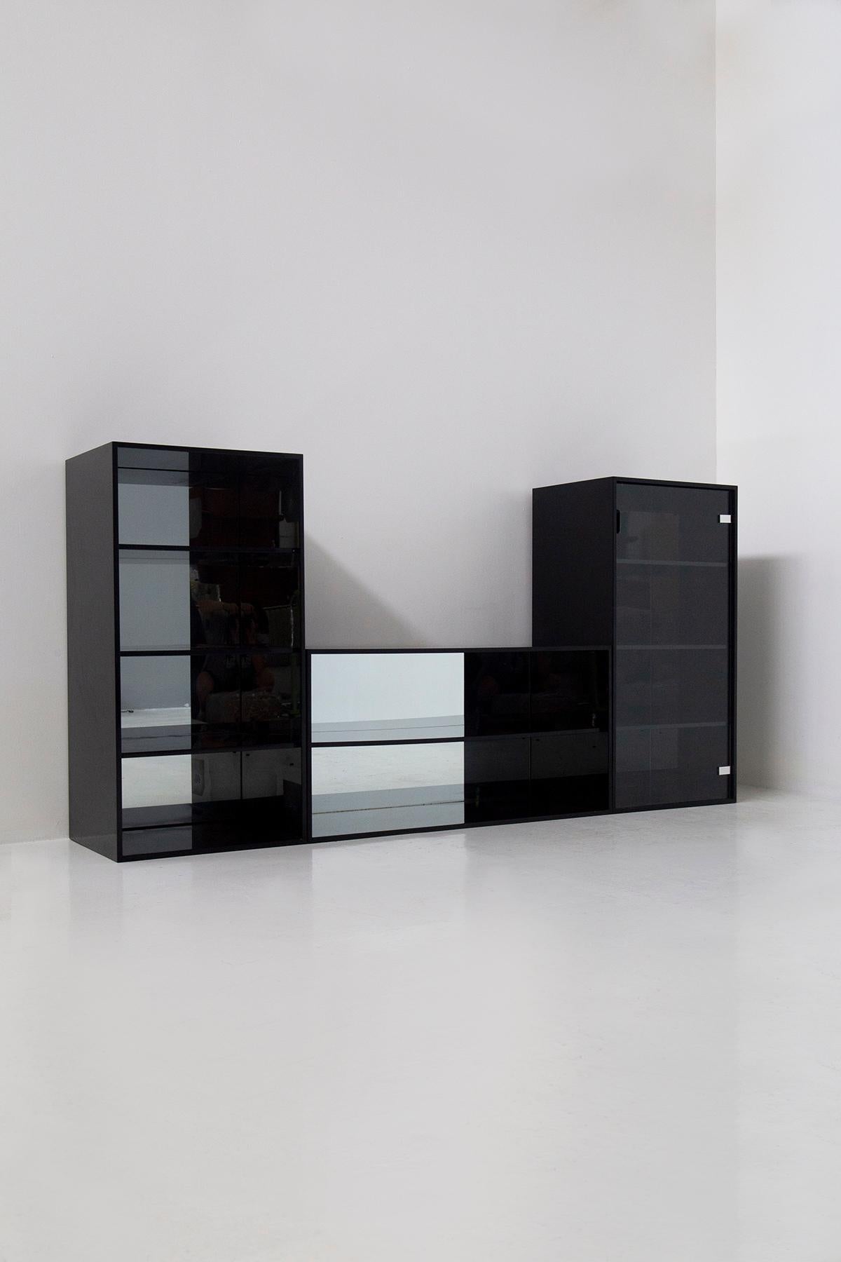 In the world of vintage Italian furniture, few pieces are as striking and versatile as your Black Acerbis lounge and bookcase set from the 1970s. This collection, comprising three distinct pieces, is not just a testament to Italian design excellence