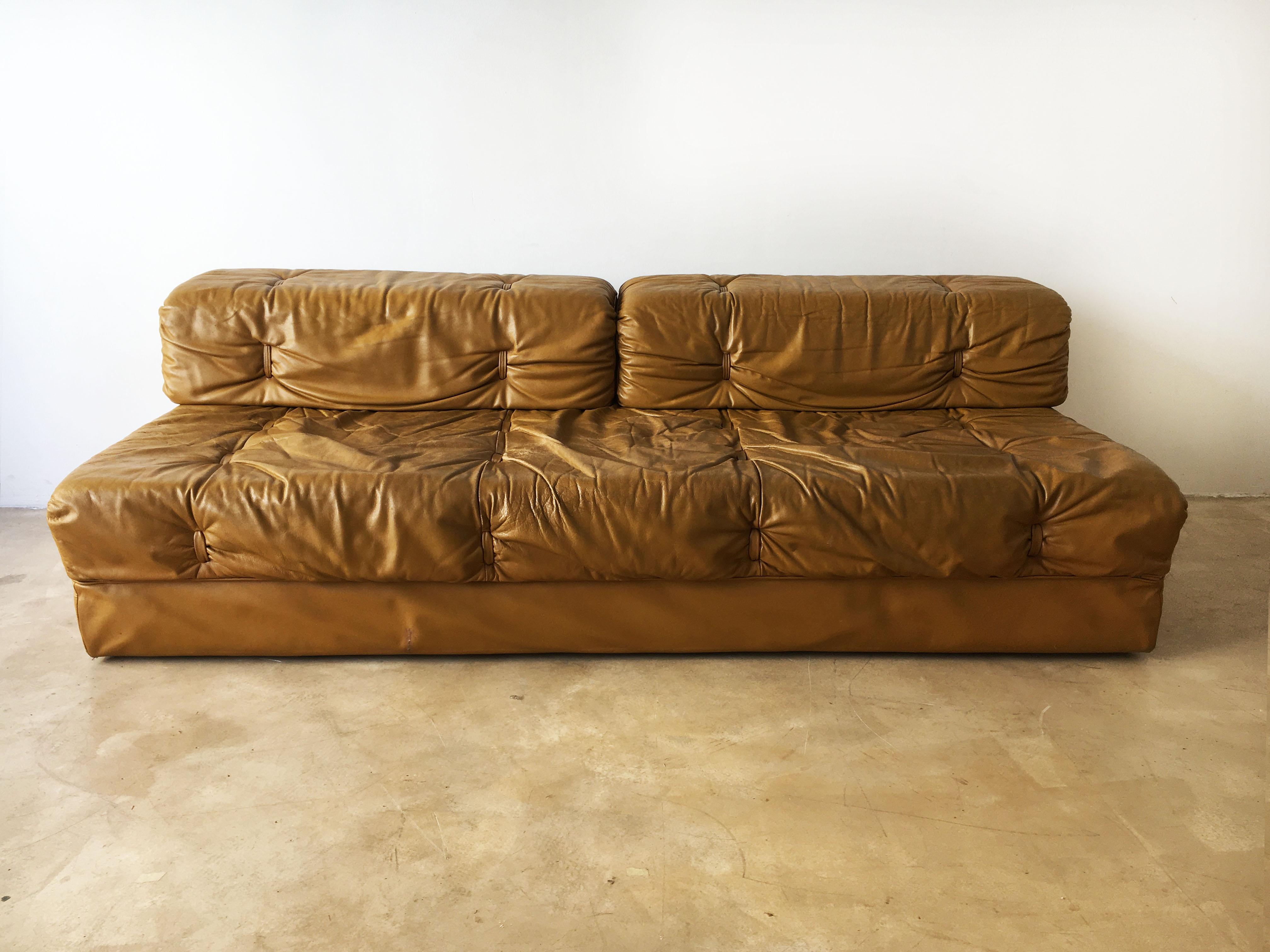 A fantastic modern modular living room suite in aged and patinated leather designed by Karl Wittmann and manufactured by Wittmann Möbelwerkstätten, Austria, 1970s. The set consists of three sectional elements which were designed to be arranged as a