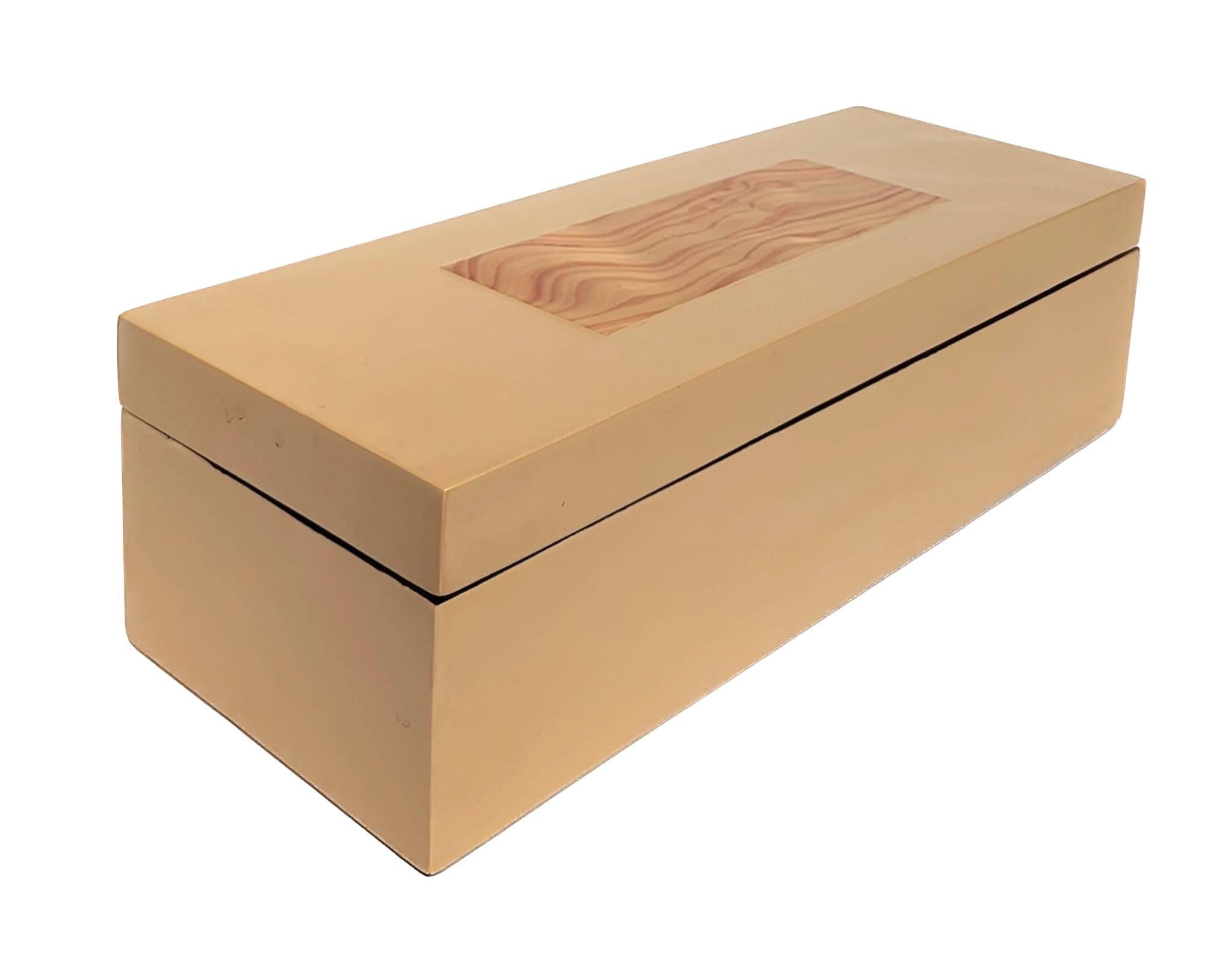 Offered is a sleek and elegant decorative box made of enamelized wood with inlaid exotic wood on the lid. The interior and bottom surface are glossy black. 

The box measures 15.75
