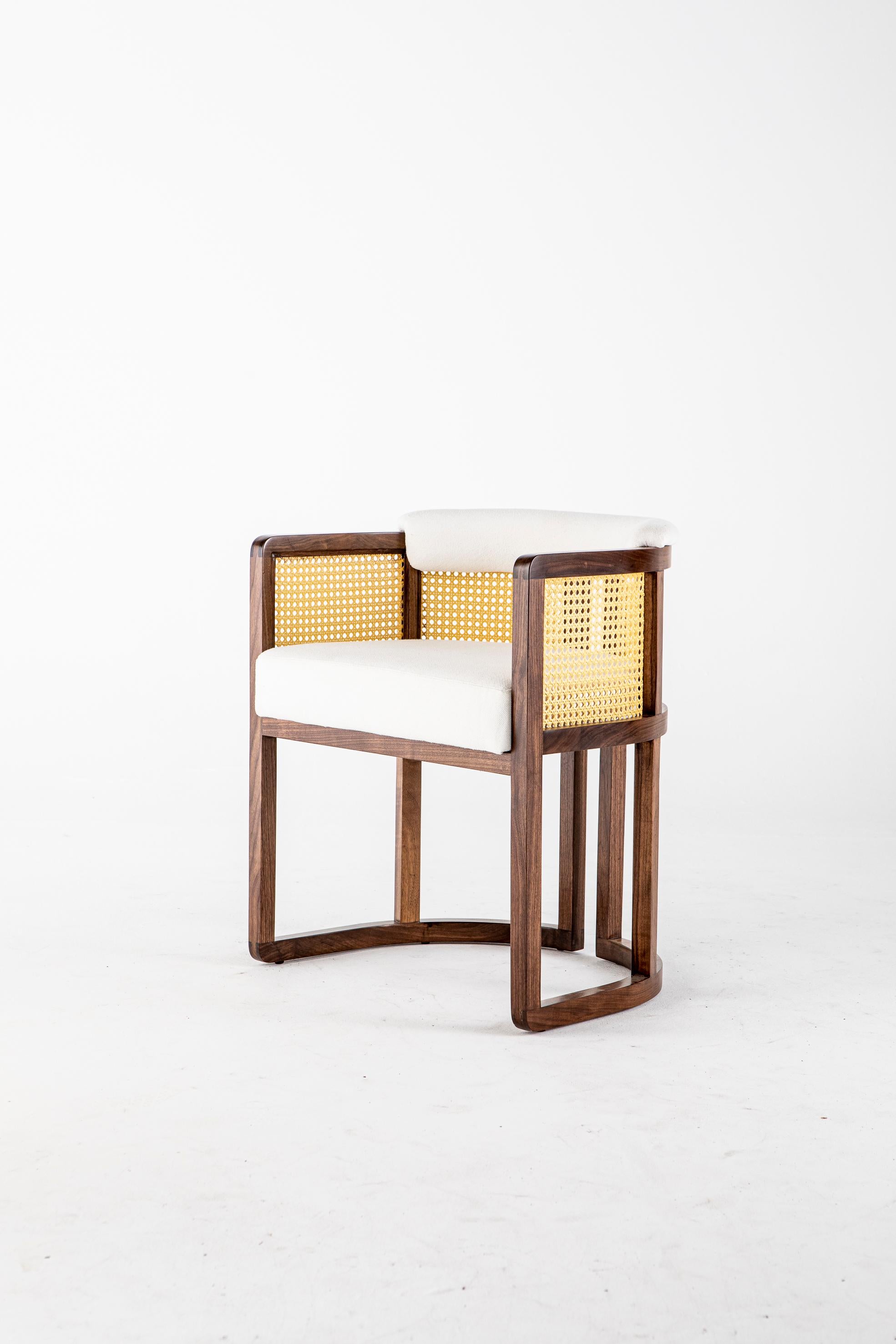 Livingston dining chair by Egg Designs
Dimensions: 62 L x 49 D x 69 H cm
Materials: Walnut timber, synthetic rattan, brass, linen upholstery

Founded by South Africans and life partners, Greg and Roche Dry - Egg is a unique perspective in