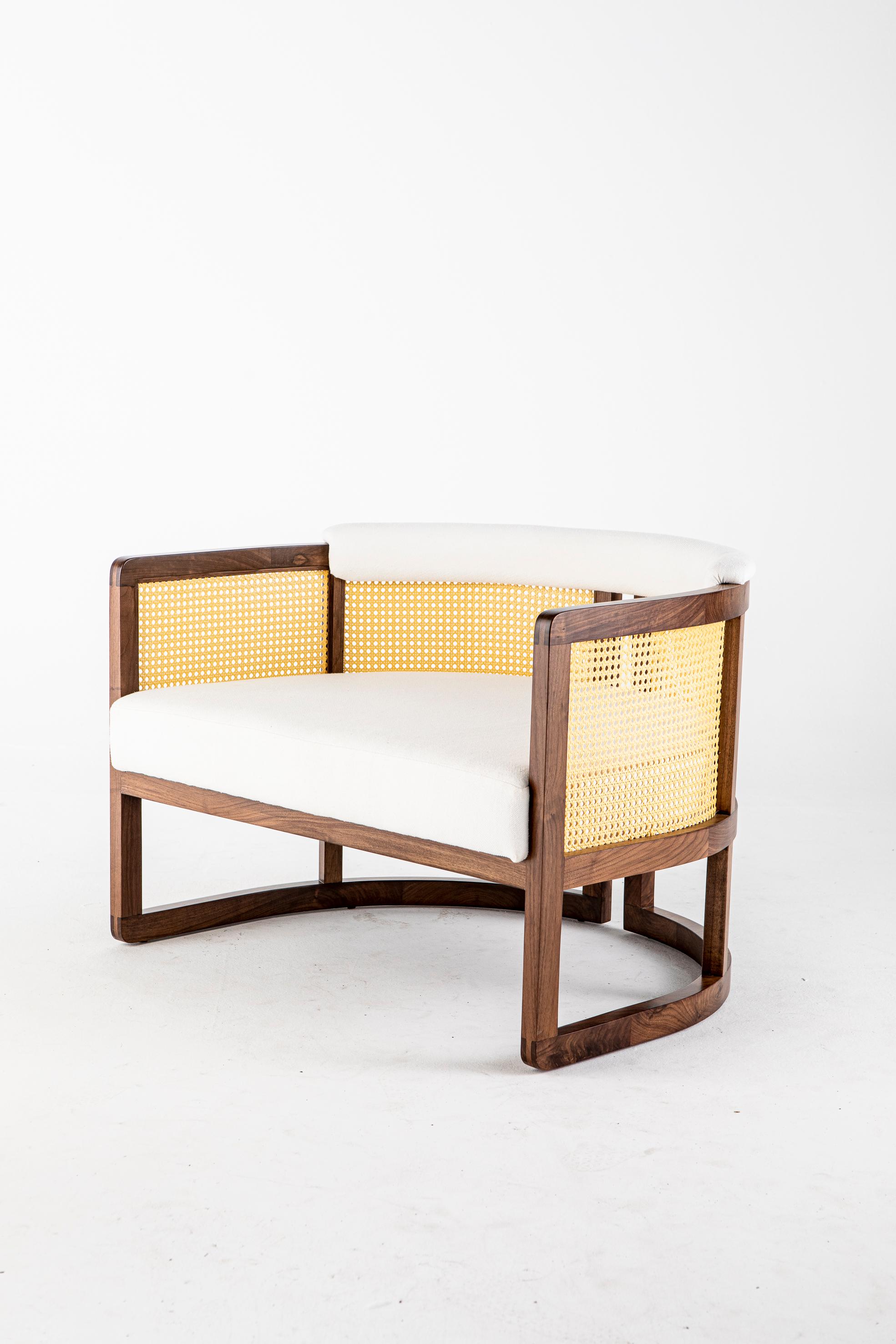 Livingston Lounge Chair by Egg Designs
Dimensions: 92 L X 75 D X 66 H cm
Materials: Walnut Timber, Synthetic Rattan, Brass, Linen Upholstry

Founded by South Africans and life partners, Greg and Roche Dry - Egg is a unique perspective in