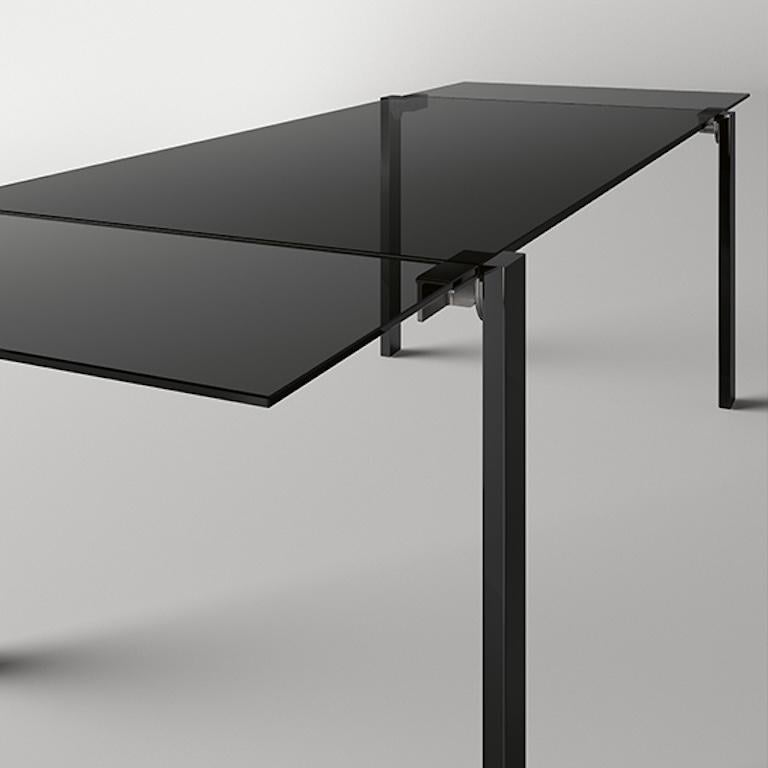 Designed and created by designer Giulio Mancini, the extending table Livingstone Dark is a distinctive element in luxury settings, dining rooms and living areas.

The great formal simplicity together with technical elements of extreme complexity are