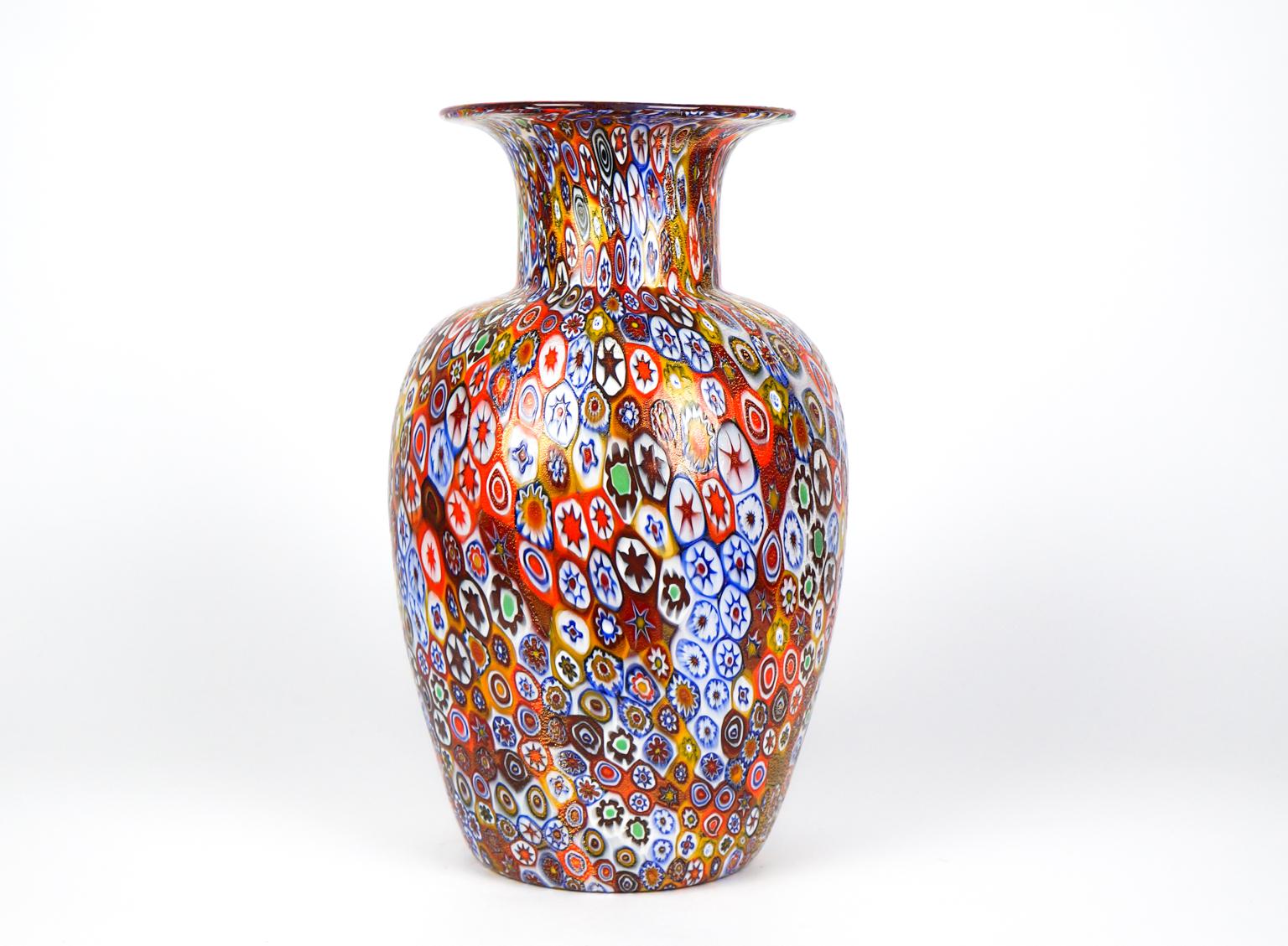 Exclusive working of Murano glass to produce this fantastic venetian blown glass vase with murrine Millefiori and covered with gold leaf 24 carats. 
This work is unique in the world for its combination of colors, elegance and sophistication. 
The