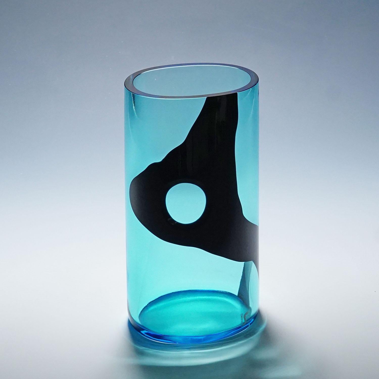 Livio Seguso for Seguso Vetri D'Arte Vase, Murano 1980s

A vintage art glass vase manufactured by Seguso Vetri D'Arte and designed by Livio Seguso in the 1980ties. Thick light blue glass with an asymetrical application in black glass and a round cut