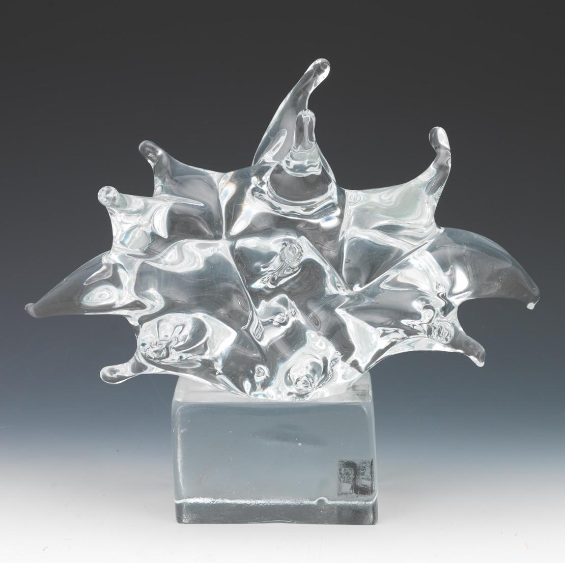  
Large clear glass abstract sculpture, on rectangular block base, by glass Maestro, Livio Seguso. 

From MuranoNet: 
Livid Seguso, glass sculptor and Maestro. 
Born in Murano in 1930. Sculptor of glass, he started in the glassworks at a very early