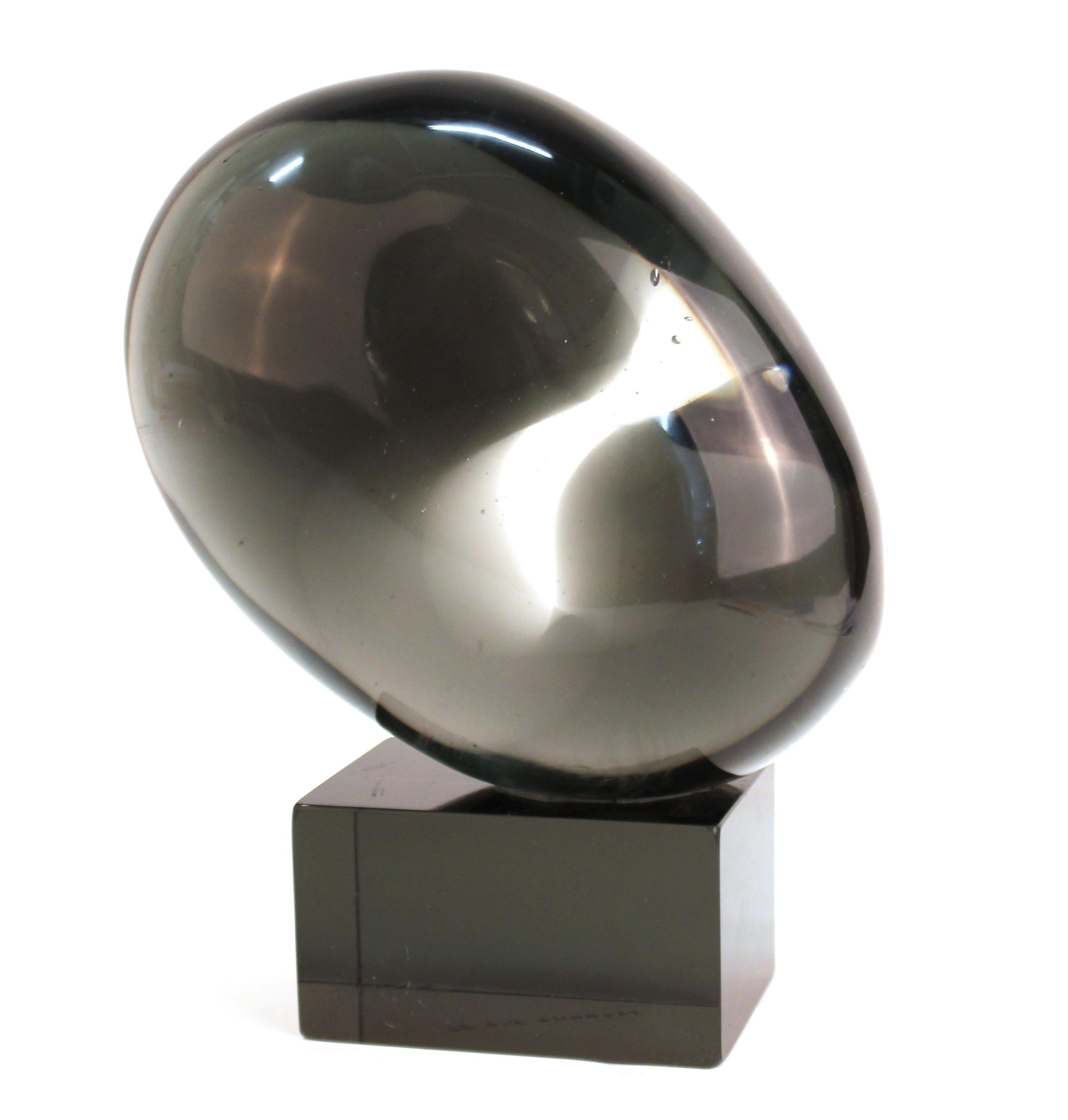 Italian modern abstract Murano glass egg sculpture atop dark glass base. The piece is signed by Livio Seguso on the back side and has the date and location etched on the bottom 