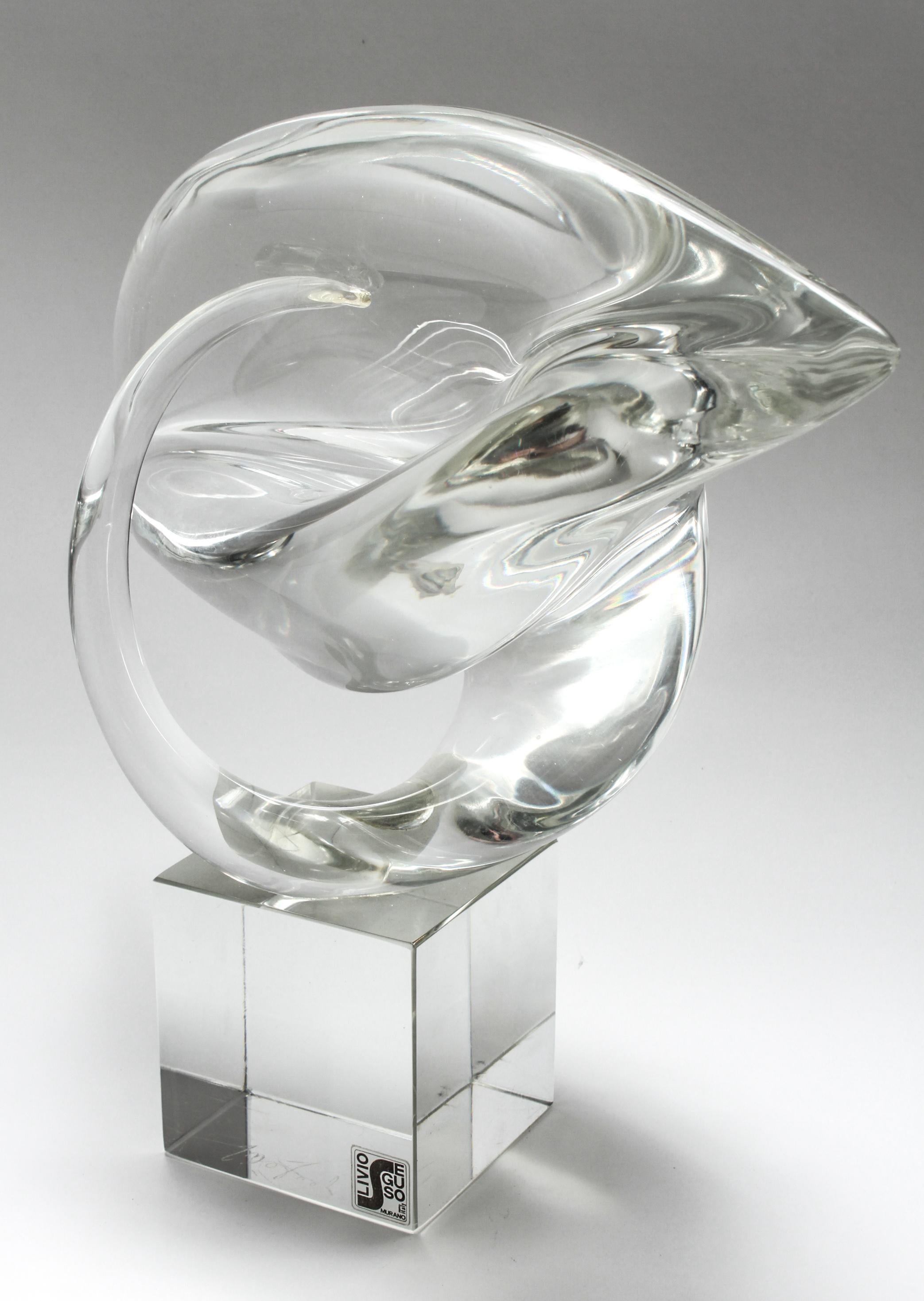 Italian Modern Murano art glass sculpture made by Livio Seguso. The piece presents an abstract organic form raised on a cube base and has a maker's label marked 