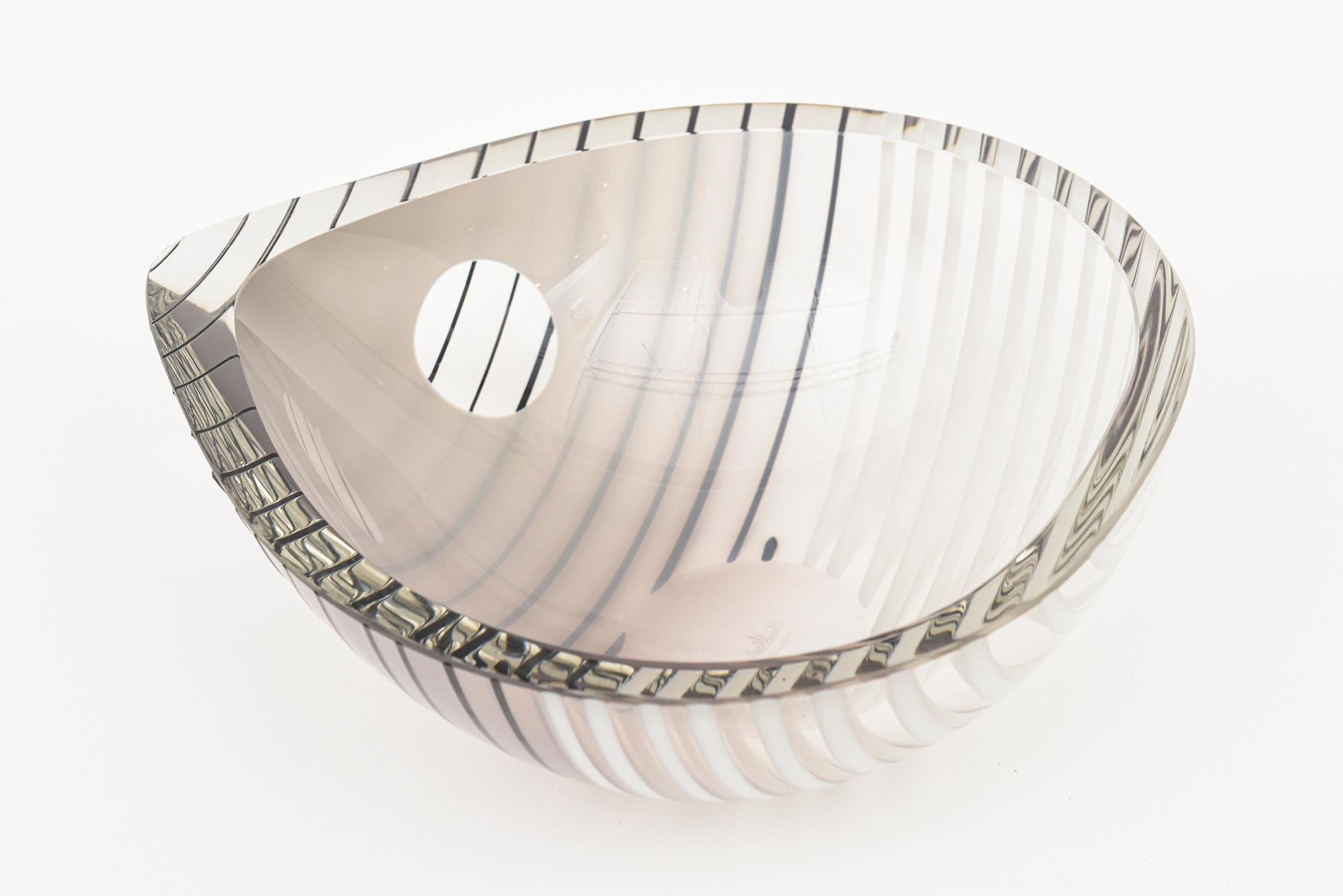 This stunning large almond shaped Italian Murano hand blown glass bowl by Livio Seguso for Rosenthal Studio LIne Germany is from the 80's. It has gradients of the colors of gray, black, light gray, white and clear. The outside is textural with