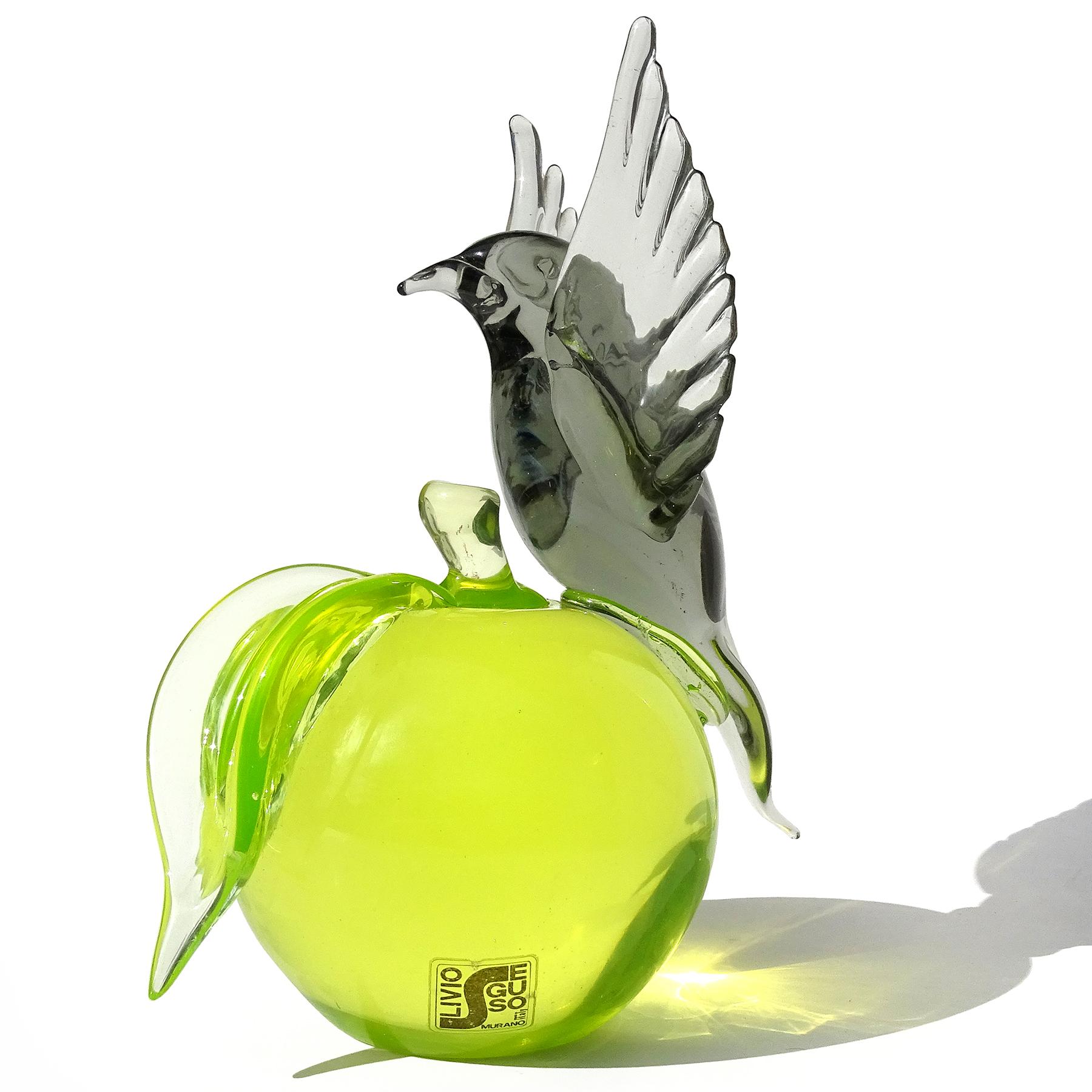 Beautiful, large vintage Murano hand blown Sommerso glowing Uranium green apple with gray bird Italian art glass sculpture. Documented to designer Livio Seguso, with original label still attached. The clear label reads 