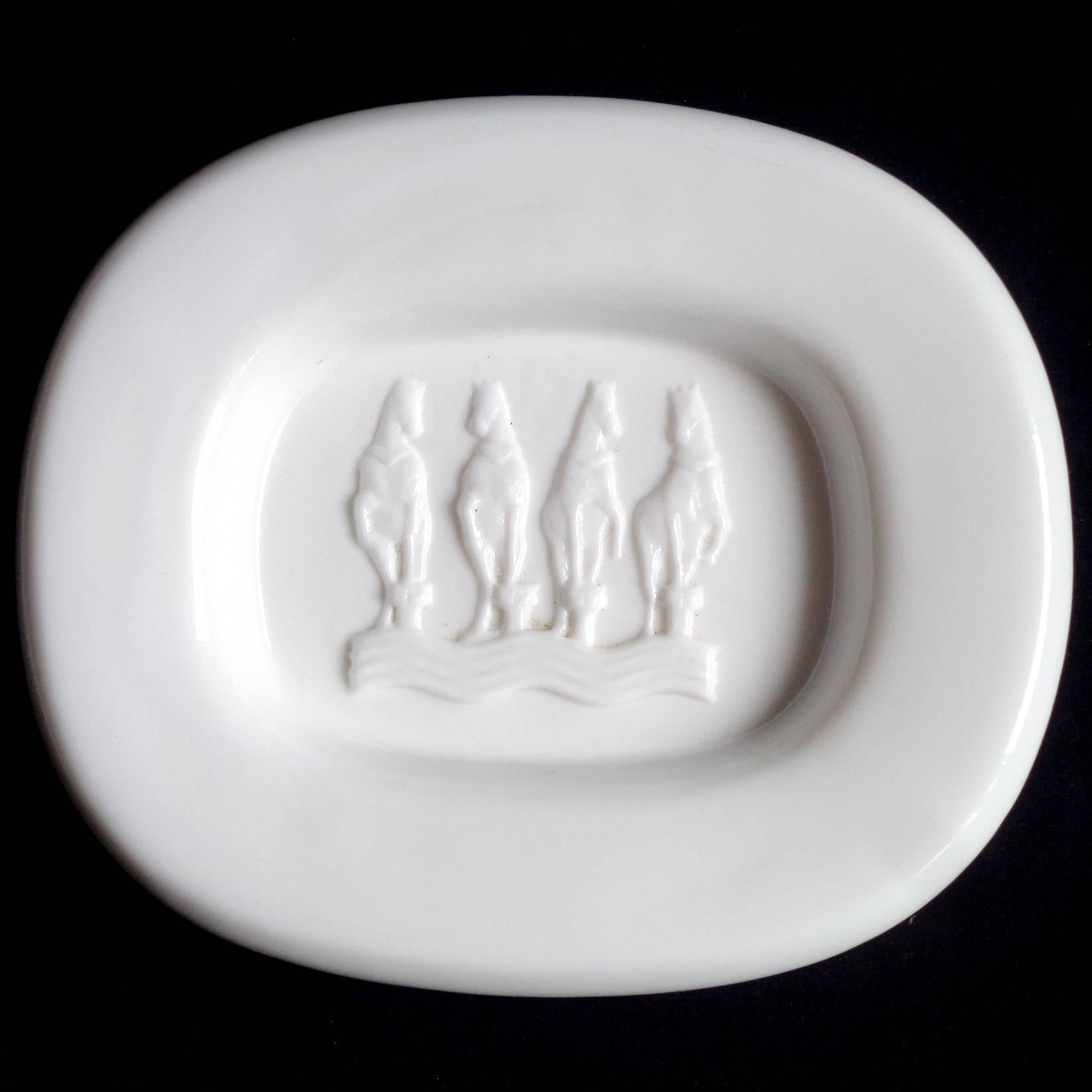 Beautiful vintage Murano hand blown white Italian decorative art glass bowl with 4 embossed rearing horses. Documented to designer Livio Seguso. I have previously owned several others with the original Live Seguso label on them. The piece was likely