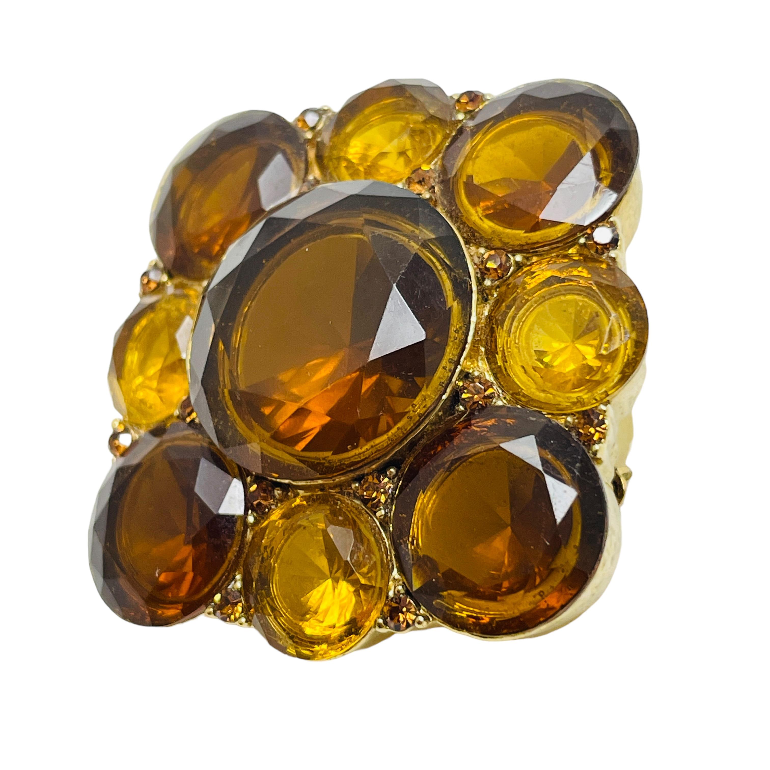 DETAILS

• signed LIZ CLAIBORNE  

• gold tone with glass stones

• vintage designer brooch

MEASUREMENTS  

• 1.75