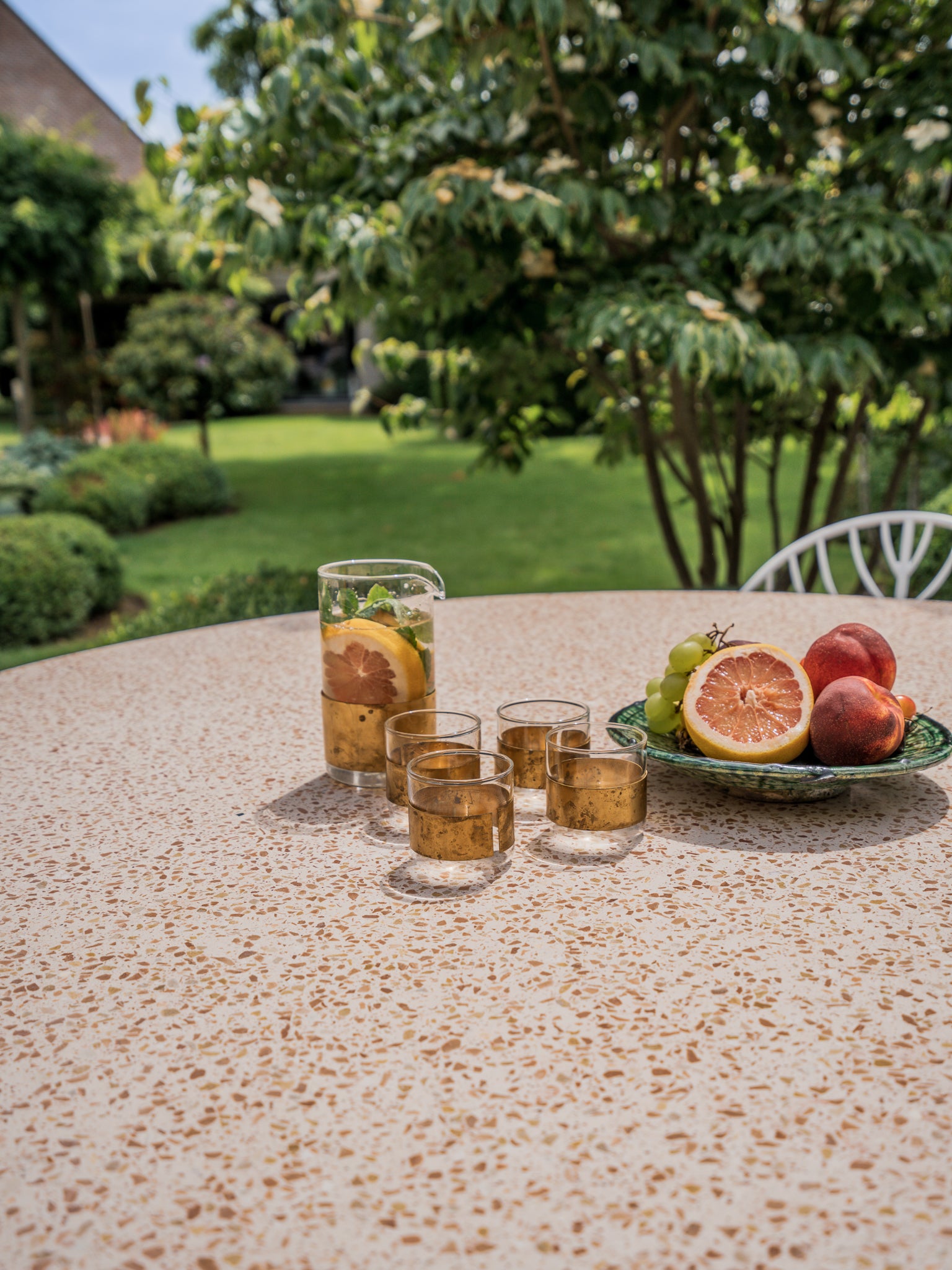 This terrazzo outdoor table is unique because it is available in many colours and stones. Your imagination is the limit. 
It is a very interesting material to work with because of the combinations you can make with colors from surrounding materials