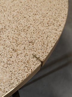 Liz Tables round terrazzo dining table with brass ring and wooden stand