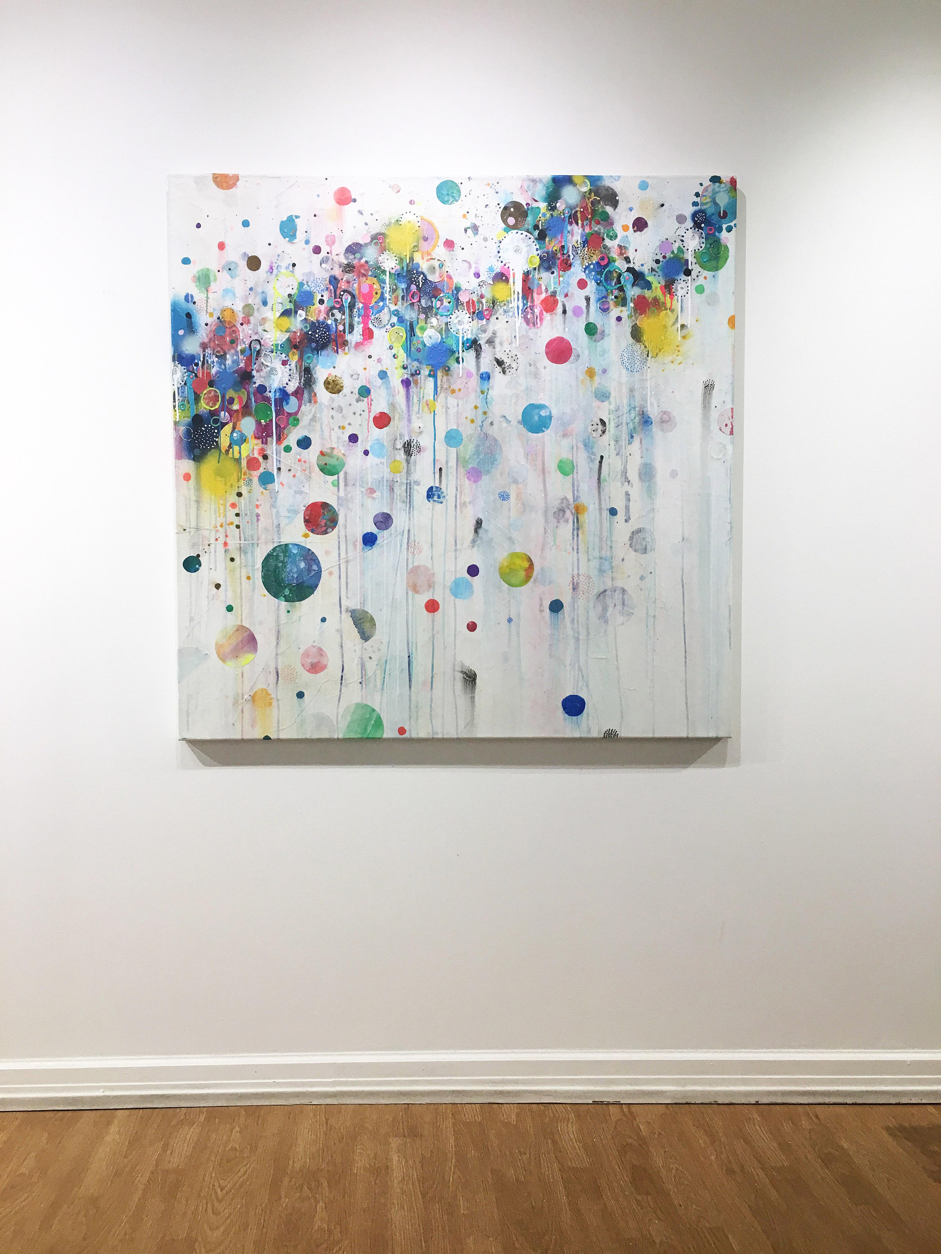 'Nico' 2019 by Seattle based abstract painter, Liz Tran. Mixed media on panel, 48 x 48 in. The featured “Party” paintings are festooned with bold neon colored bubbles, streamers, splatters, and elongated drips. Composed of ink, acrylic, graphite,