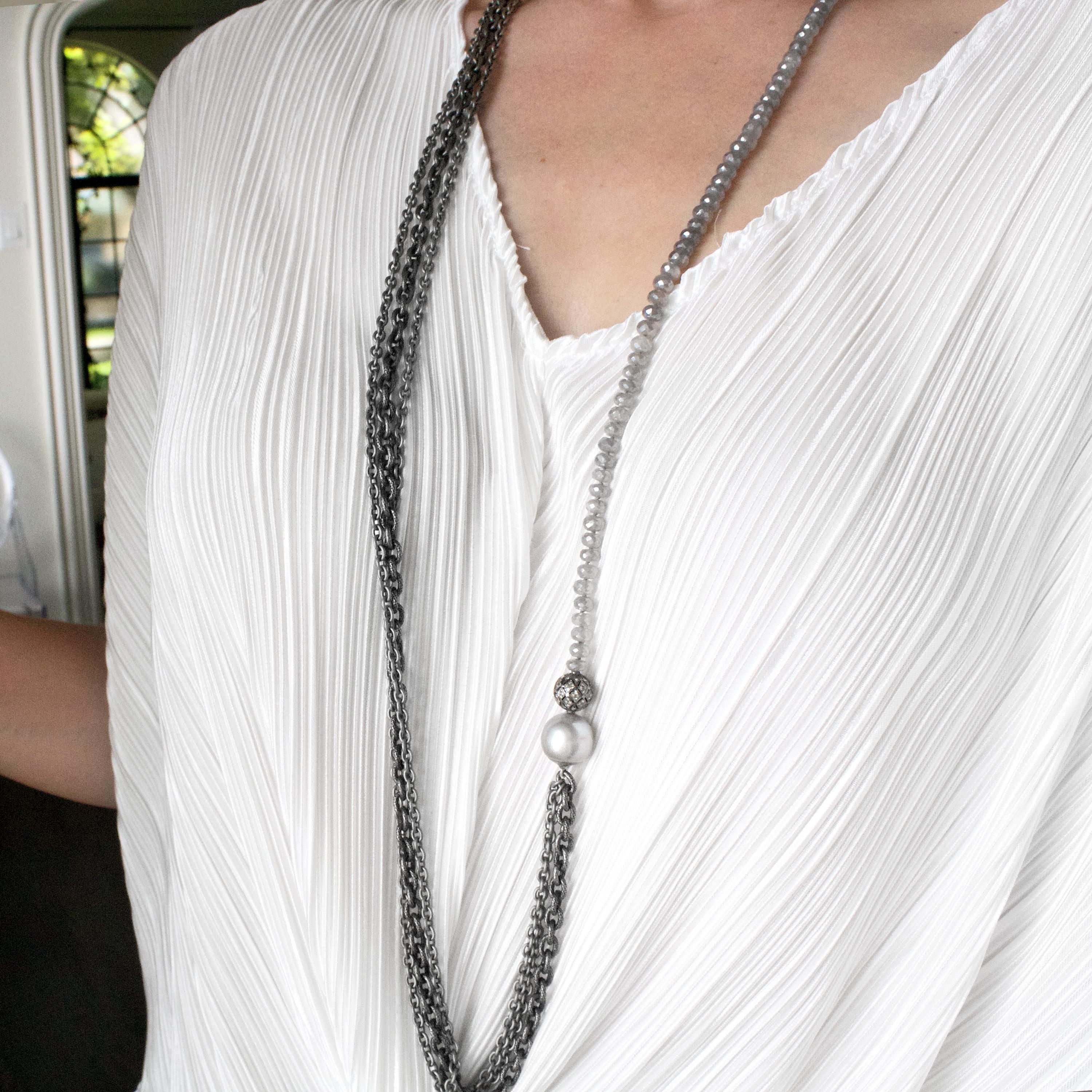 Long Triple Chain Necklace Necklace handcrafted by jewelry artist Liza Beth featuring a strand of faceted gray moonstones accented by a Tahitian pearl and an inlaid-diamond filigree bead in oxidized sterling silver, strung on a stainless steel