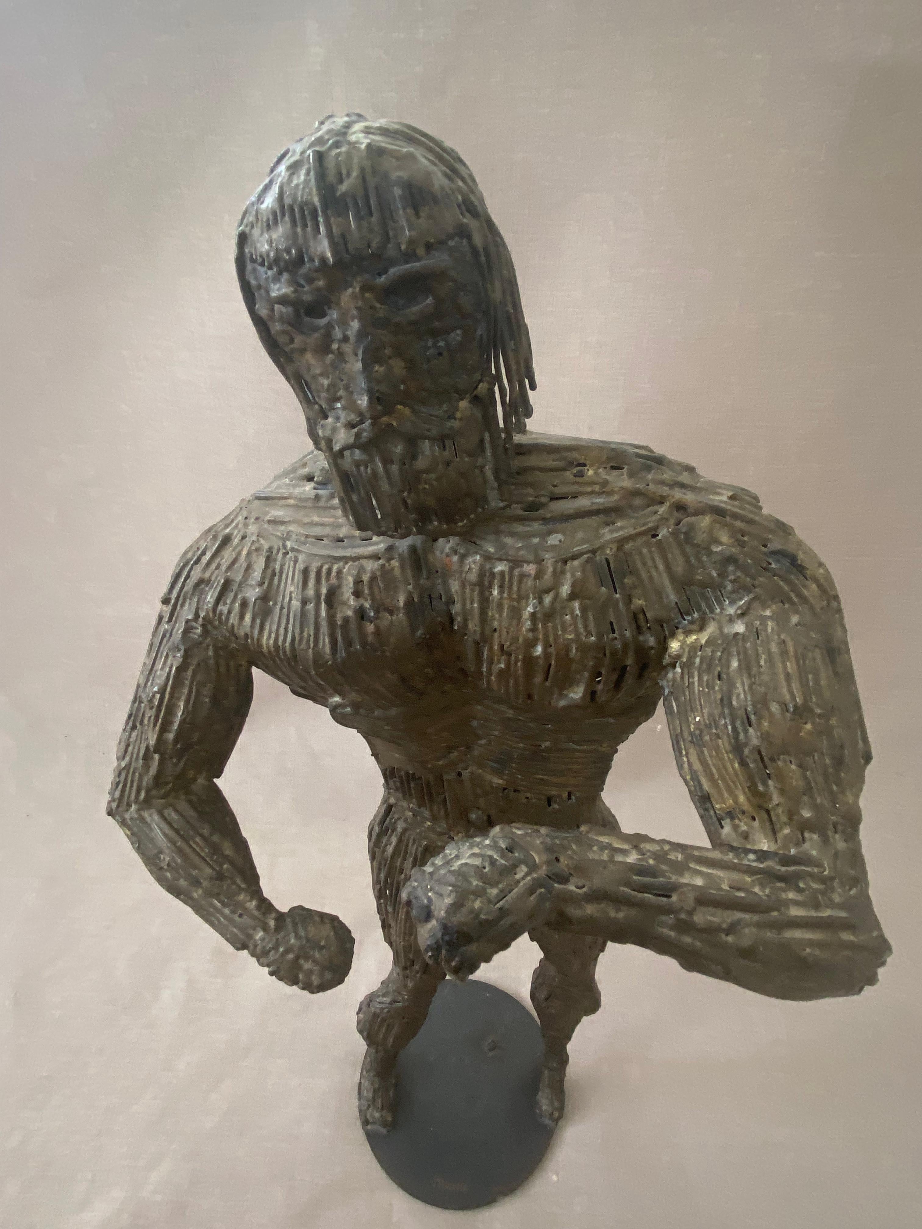 Brutalist sculpture of Hercules by Liza Monk - Los Angeles based WPA artist.
Heavy and welded pieces of metal/ nails.

