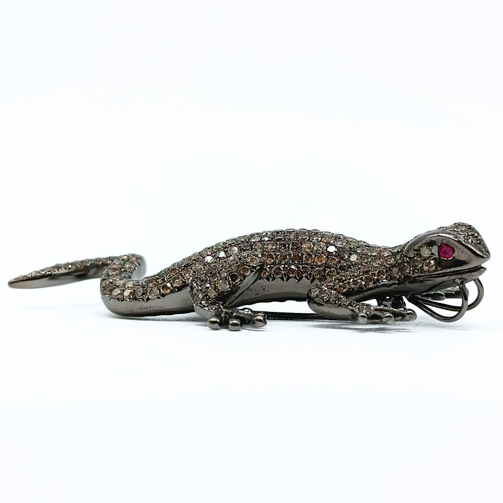 Lizard Brooch
18k White Gold 18,80gr
2 round-cut Rubies 0,08k in the eyes
336 white, yellow and brown brilliant-cut Diamonds 5,80k