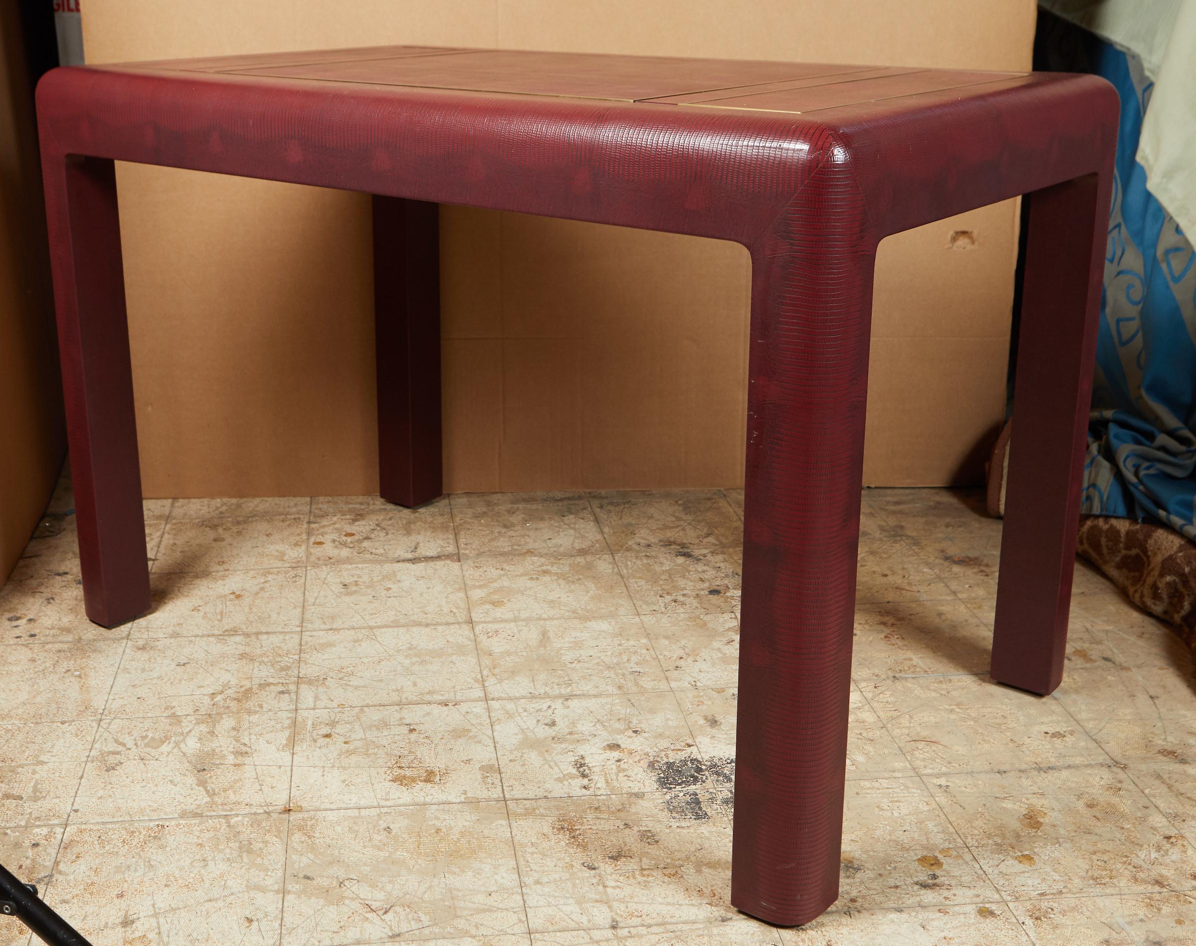 Faux leather and brass games table by Karl Springer featuring a chess and backgammon board , including the original chess pieces and backgammon pieces.
Signed : ''Karl Springer 1991