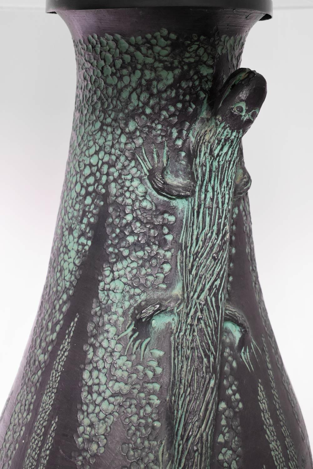 Glazed and incised terracotta lamp decorated with low relief lizards on a black background. France, 1970s.