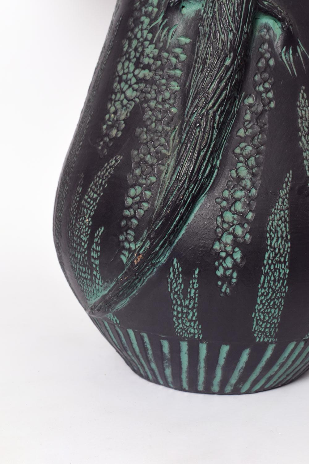 Glazed and incised terracotta lamp decorated with low relief lizards on a black background. France, 1970s. 