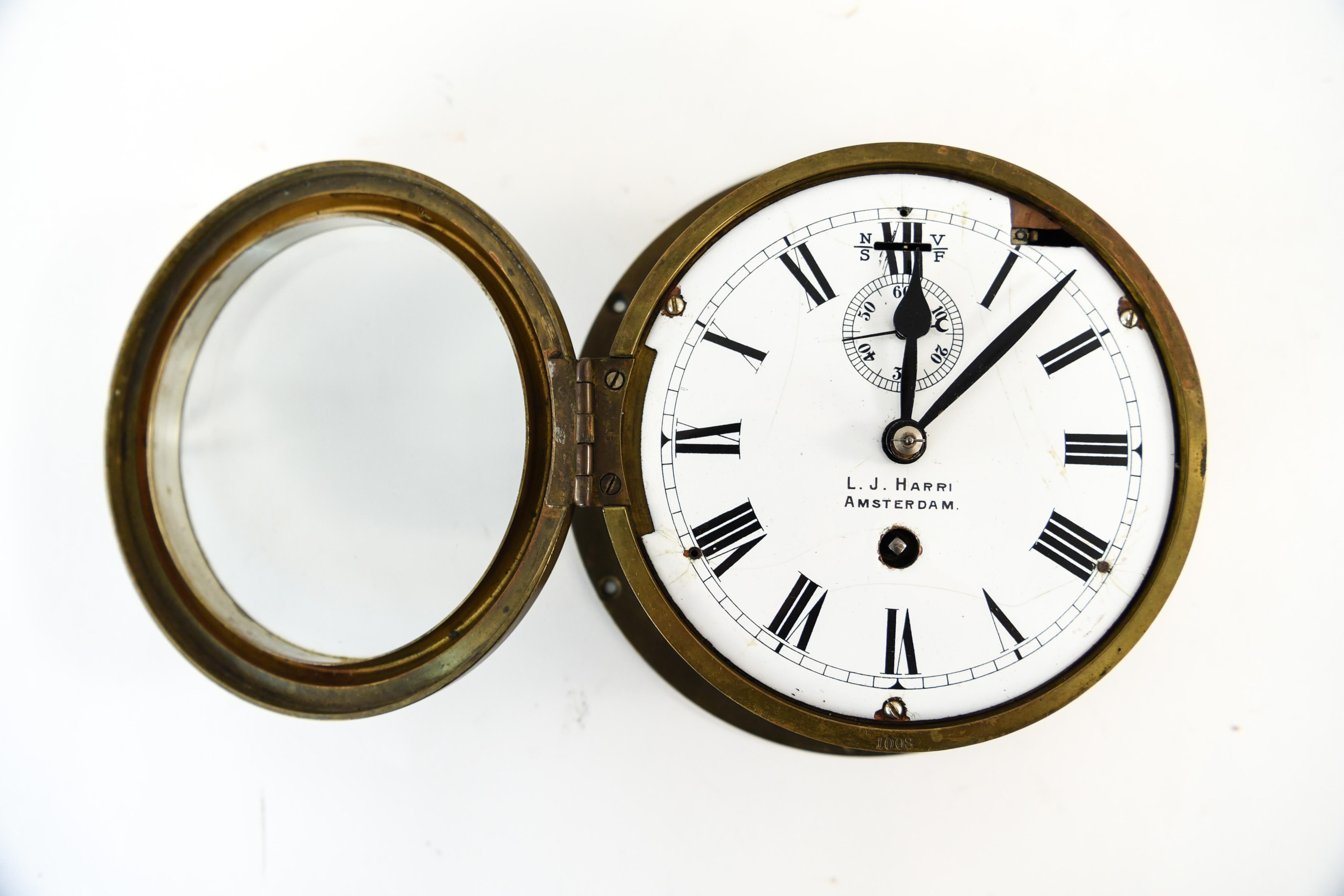 Add a nautical element to an interior with this L.J. Harri Amsterdam ship's clock. May be in need of restoration to function; not tested. Charming vintage condition.