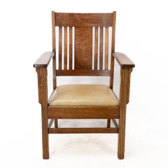 L&JG Stickley Arts & Crafts oak armchair with curved back & shaped arm supports