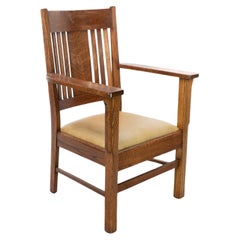 L&JG Stickley Arts & Crafts oak armchair with curved back & shaped arm supports