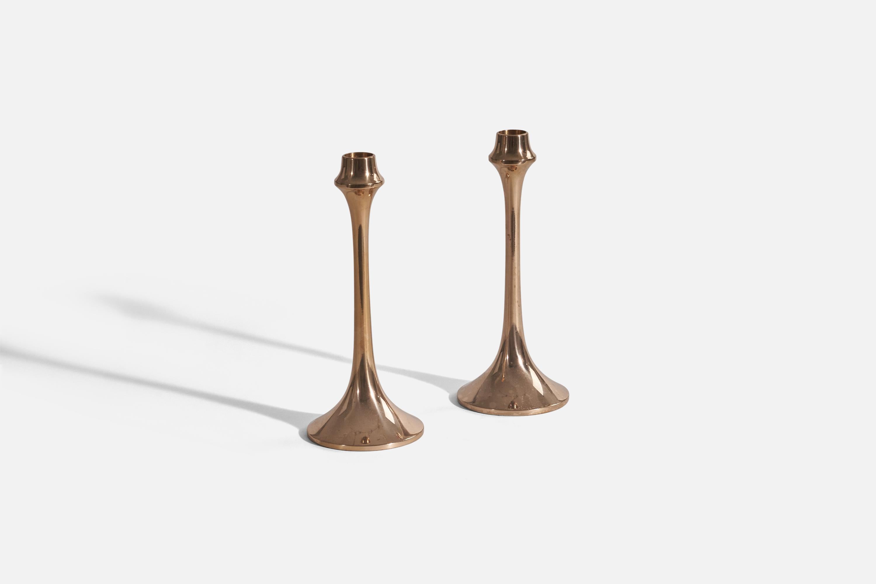 A pair of brass candlesticks designed and produced by Ljuders Nickelsilverfabrik AB, Hovmantorp, Sweden, 1976. 