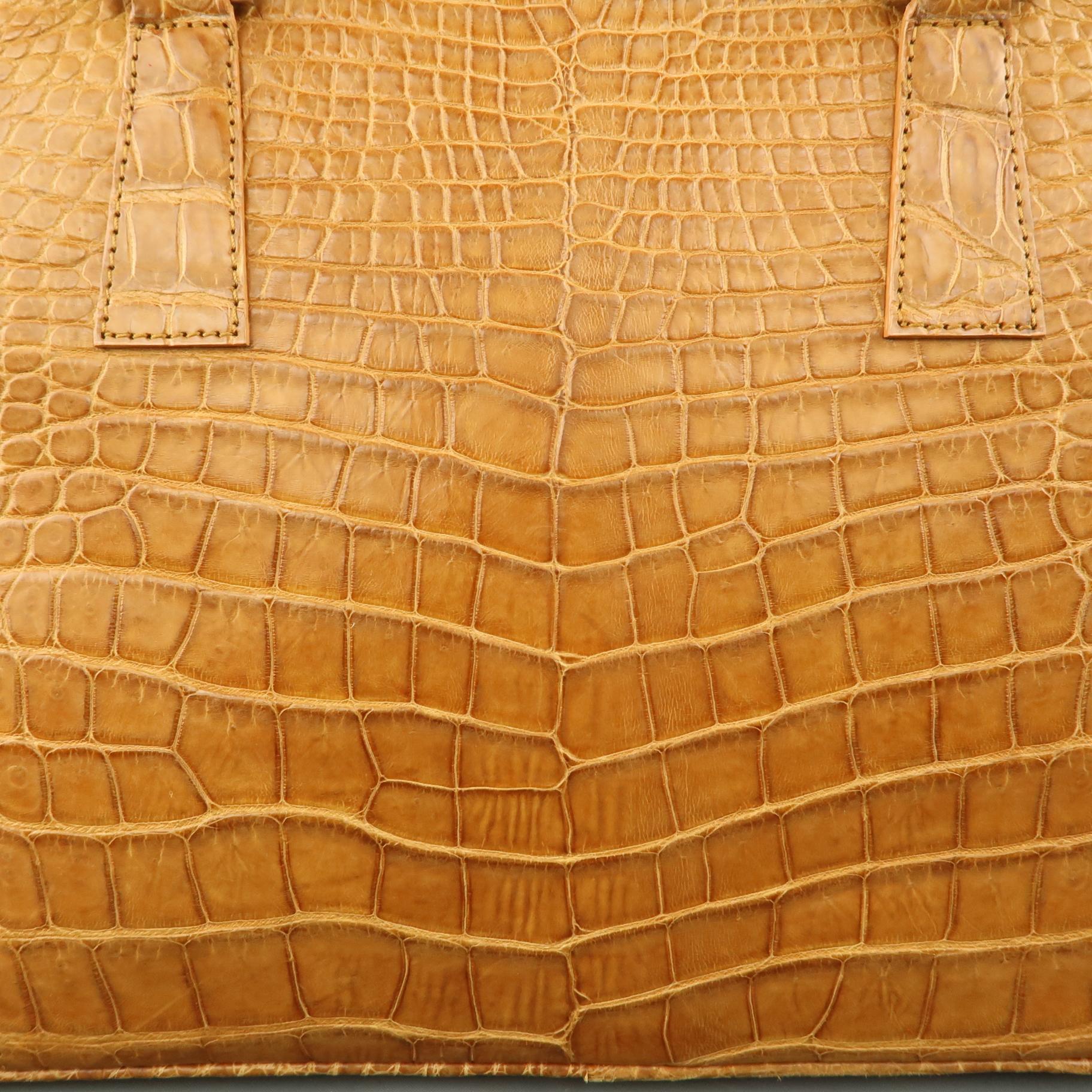 LK LEATHER BANGKOK handbag comes in genuine tan crocodile leather leather with double rolled top handles, silver tone hardware, top zip closure, and suede interior.
 
Excellent Pre-Owned Condition.
 
Measurements:
 
Length: 14.5  in.
Width: 4.5
