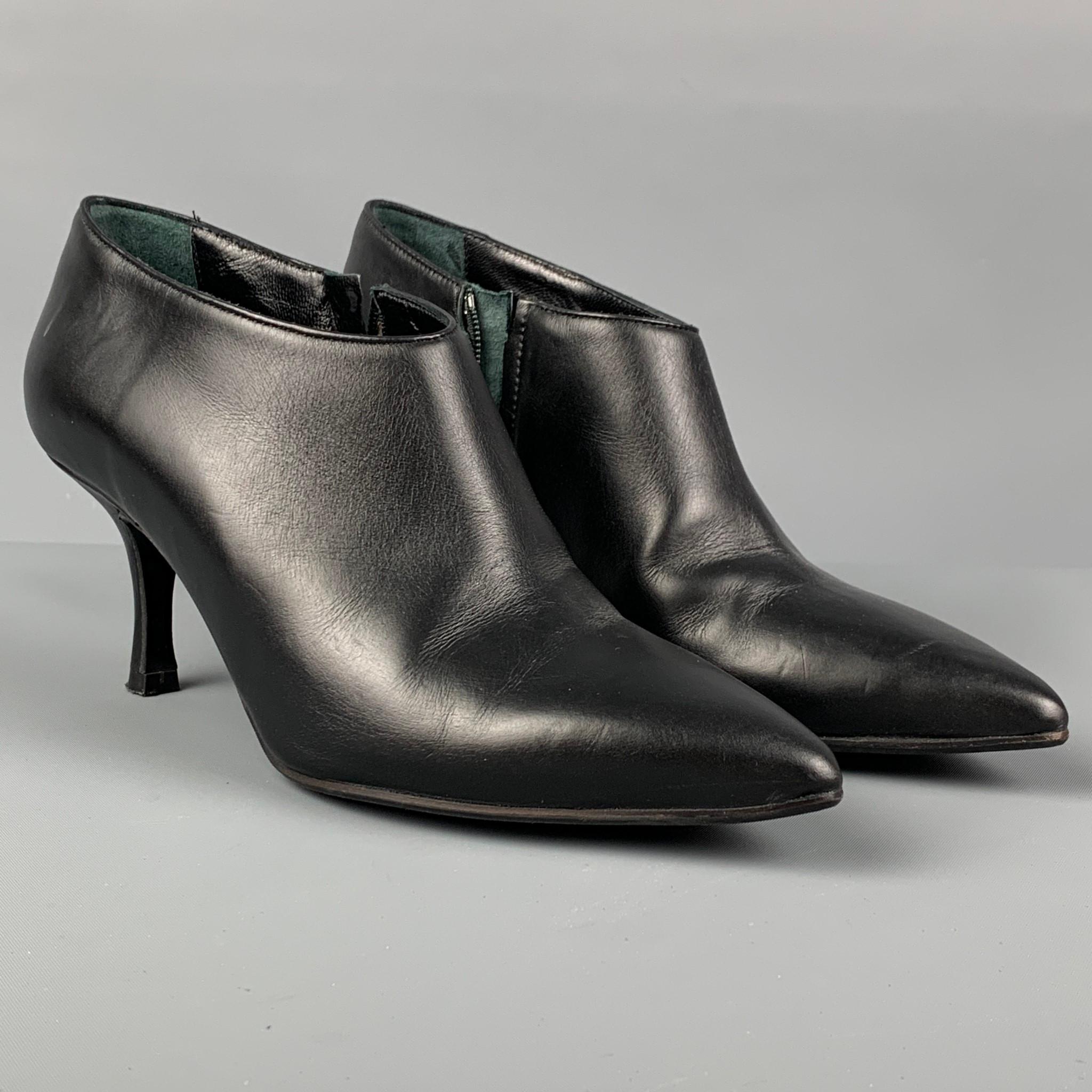 L.K.BENNETT booties comes in a black leather featuring a pointed toe, kitten heel, and a side zipper closure. Made in Italy. 

Very Good Pre-Owned Condition.
Marked: 36
Original Retail Price: $465.00

Measurements:

Heel: 3 in. 