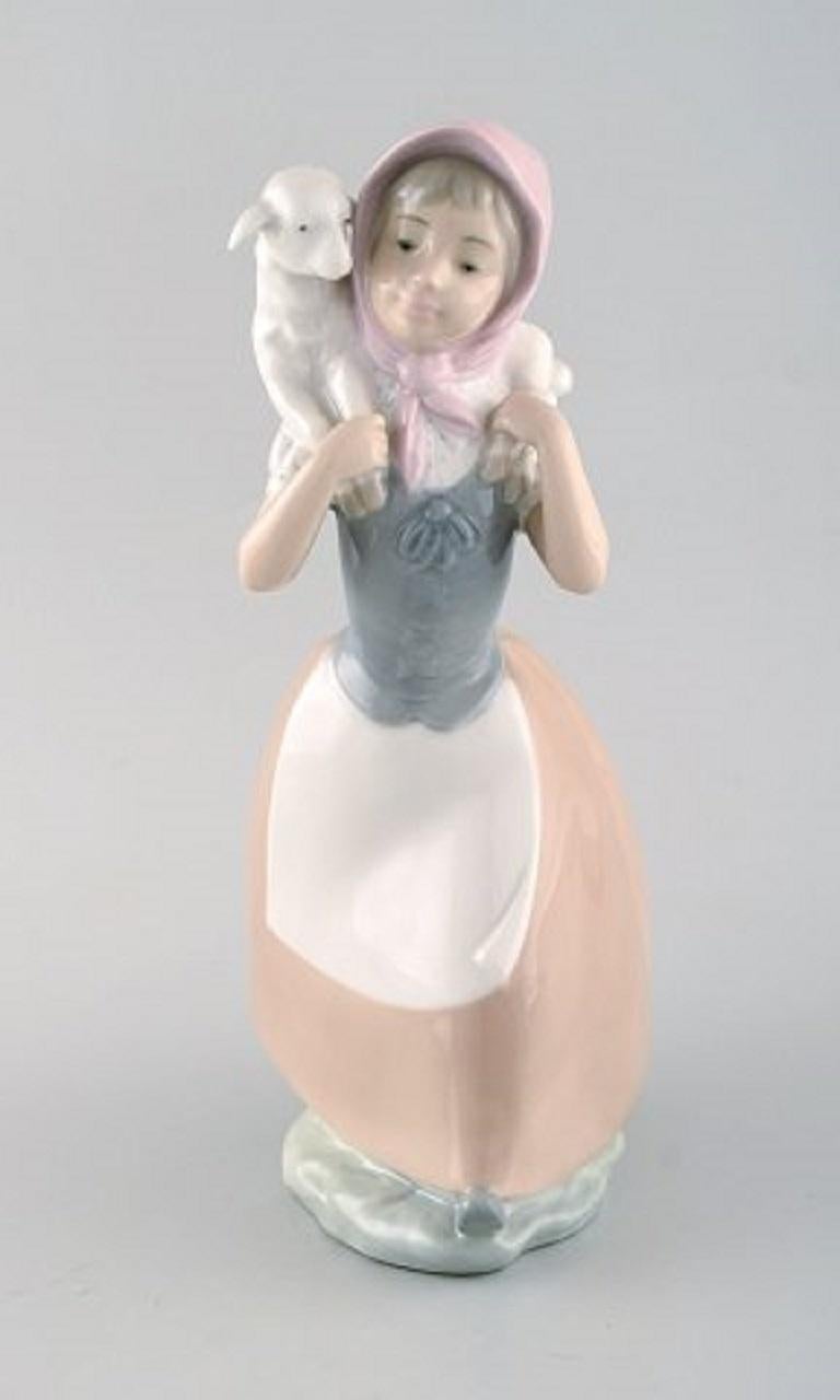 Late 20th Century Lladro and Nao, Spain, Three Porcelain Figurines, Young Girls with Farm Animals