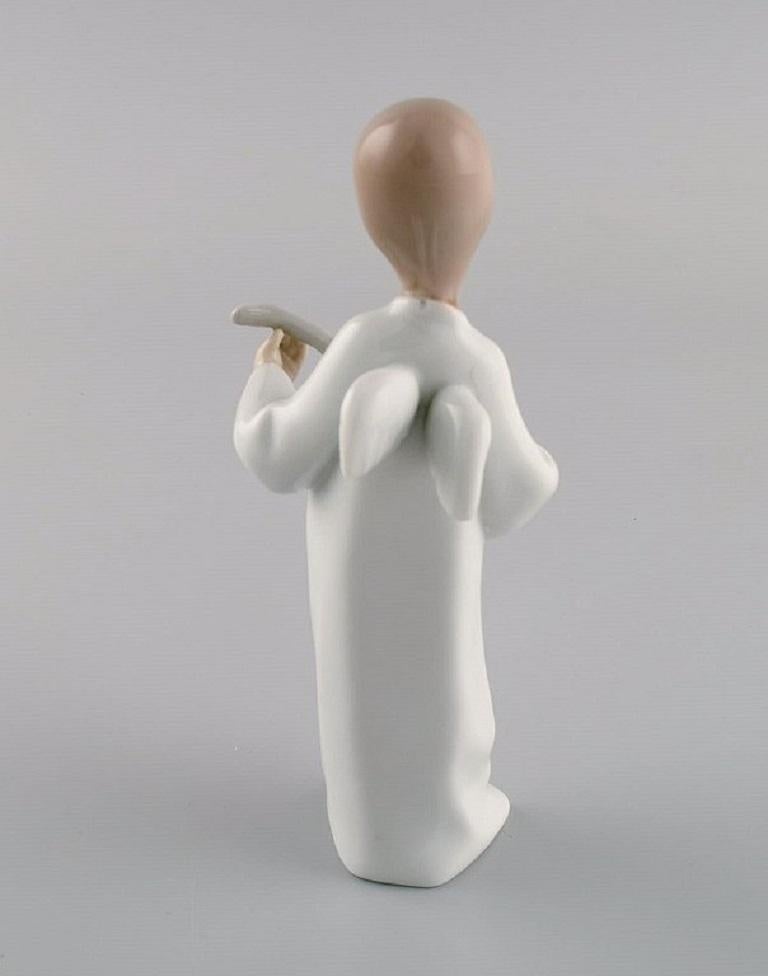 Lladro and Nao, Spain, Two Porcelain Figurines, Girl with Lamb and Angel Boy In Excellent Condition In Copenhagen, DK