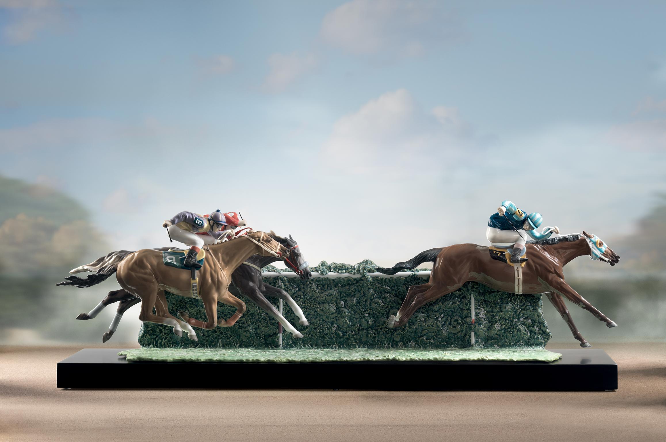 Glossy porcelain sculpture racing in the racetrack limited series represented by three horses with jockey of intense red and blue colors, combination of different glazes. Base included.
 