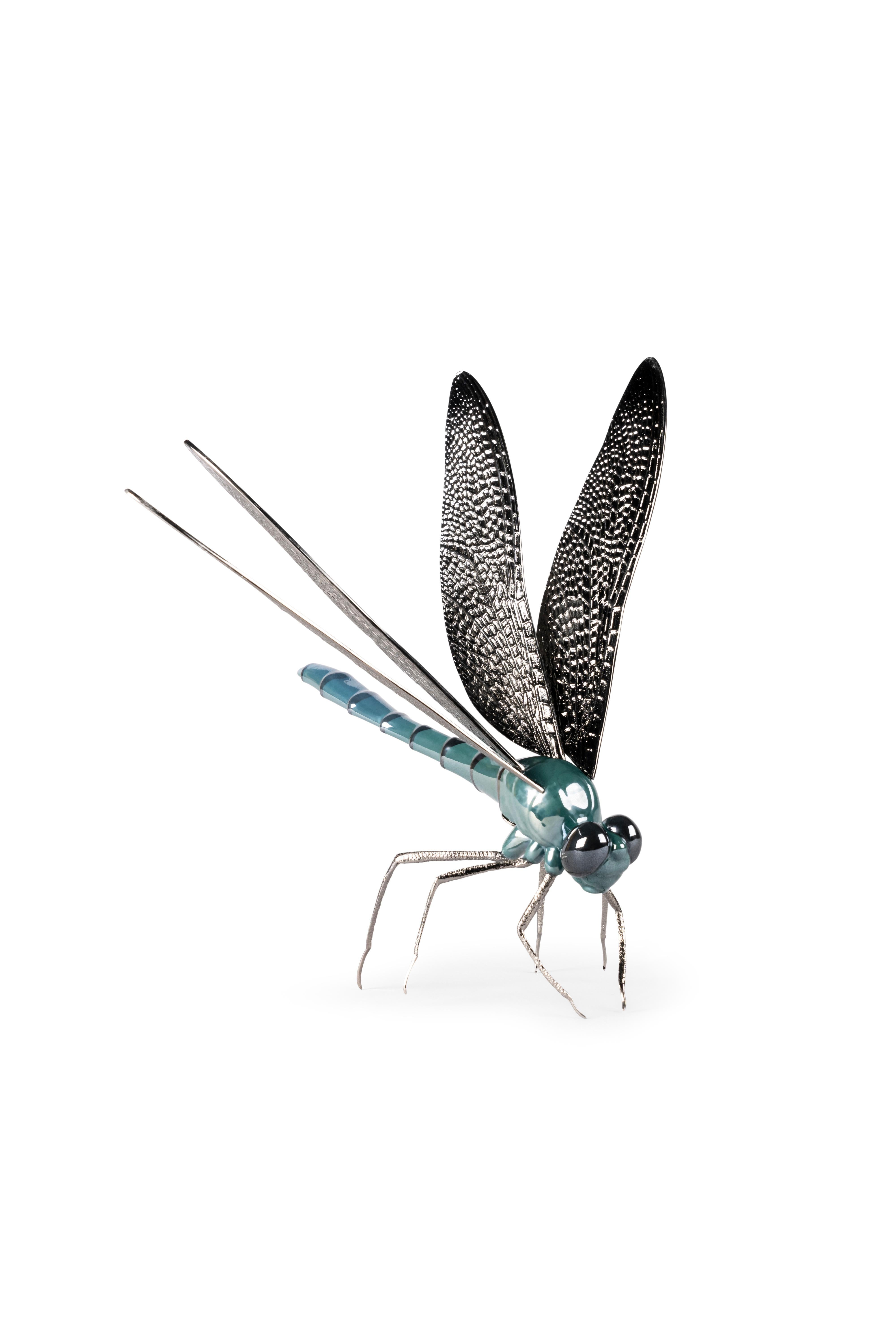 An innovative porcelain and metal creation inspired by one of the fascinating creatures in nature. Part of the Awesome Insects Collection. This original piece is made in glazed porcelain and decorated with pearl luster. The legs and wings are in