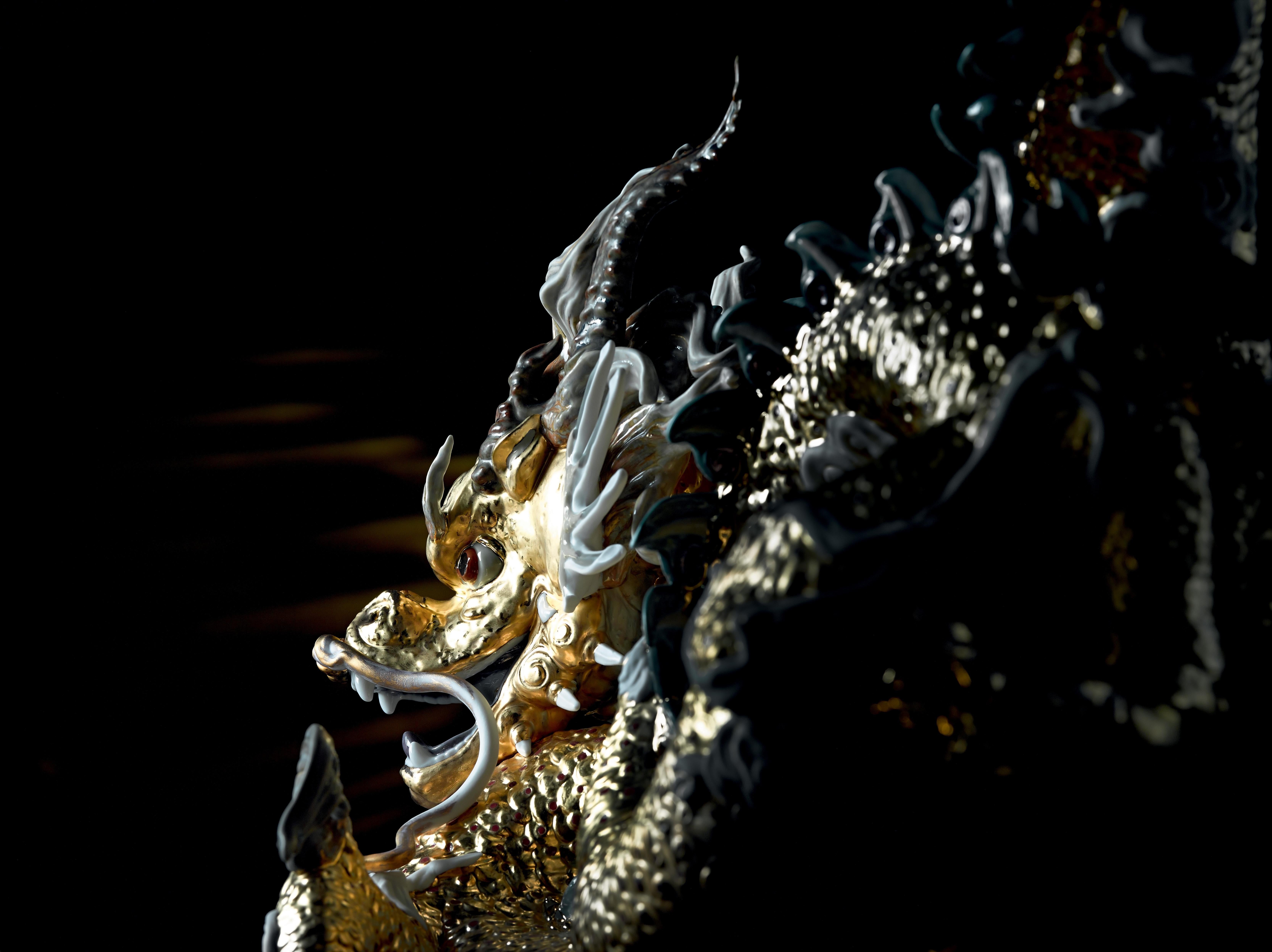 Limited edition dragon sculpture in matte porcelain with gold lustre. A symbol of power and prosperity in Eastern culture, this magical creature, the bearer of good luck, is the protagonist in this spectacular High Porcelain limited edition. The