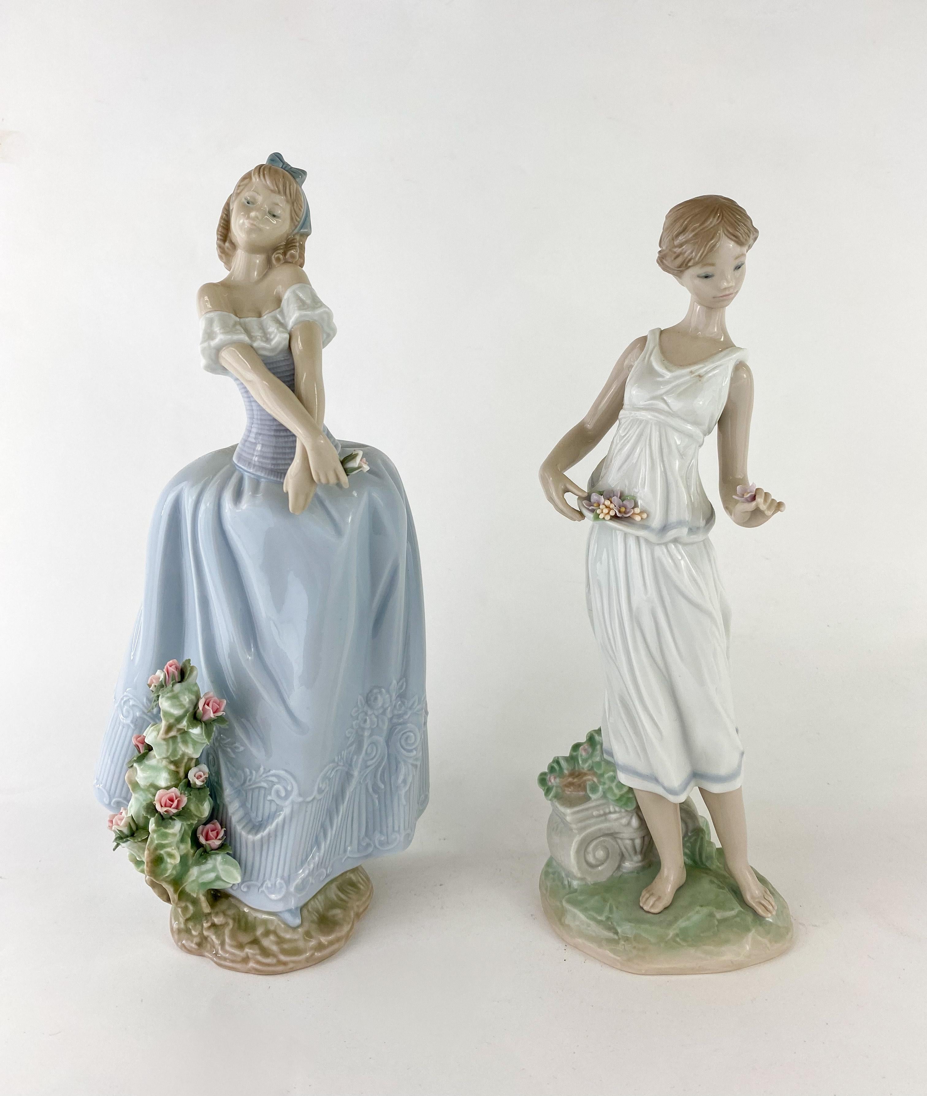 A set of two LLadro figurines. One is 