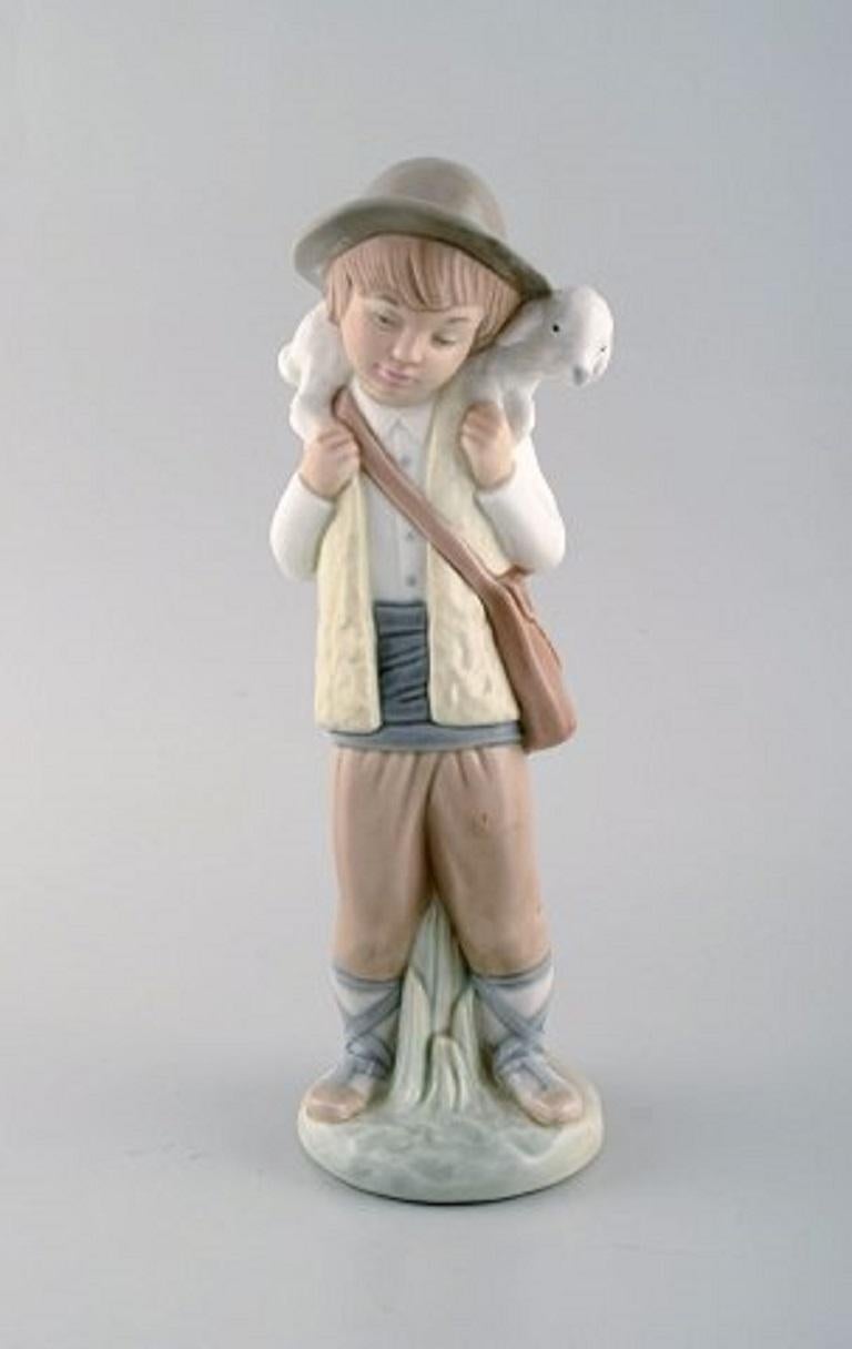 Lladro, Nao and Zaphir, Spain, Three Porcelain Figurines, Young Boys, 1980s In Good Condition In København, Copenhagen