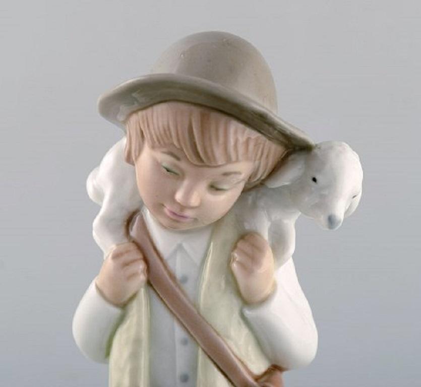 Late 20th Century Lladro, Nao and Zaphir, Spain, Three Porcelain Figurines, Young Boys, 1980s