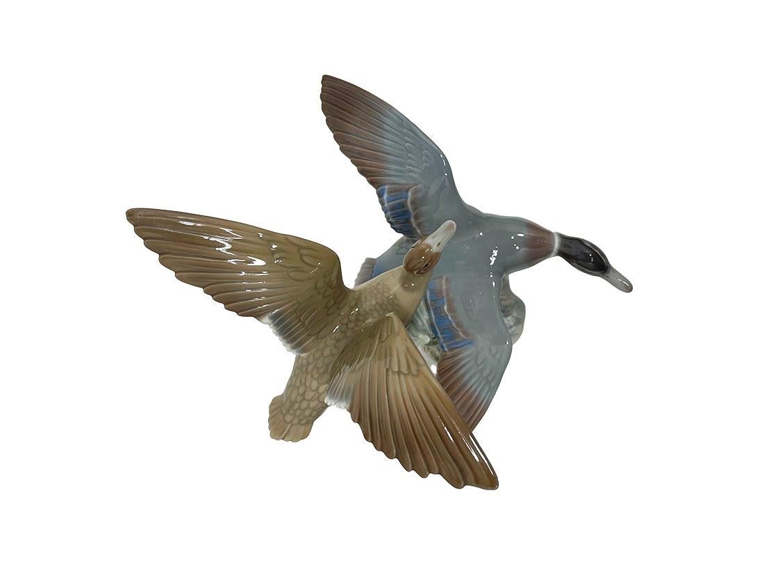 Lladró porcelain figurine of flying ducks, 1970s

Lladró is a Spanish brand dedicated since 1953 to the creation of art porcelain figurines at the brand's only factory in the World, in Valencia. This porcelain figurine of two duck flying is made