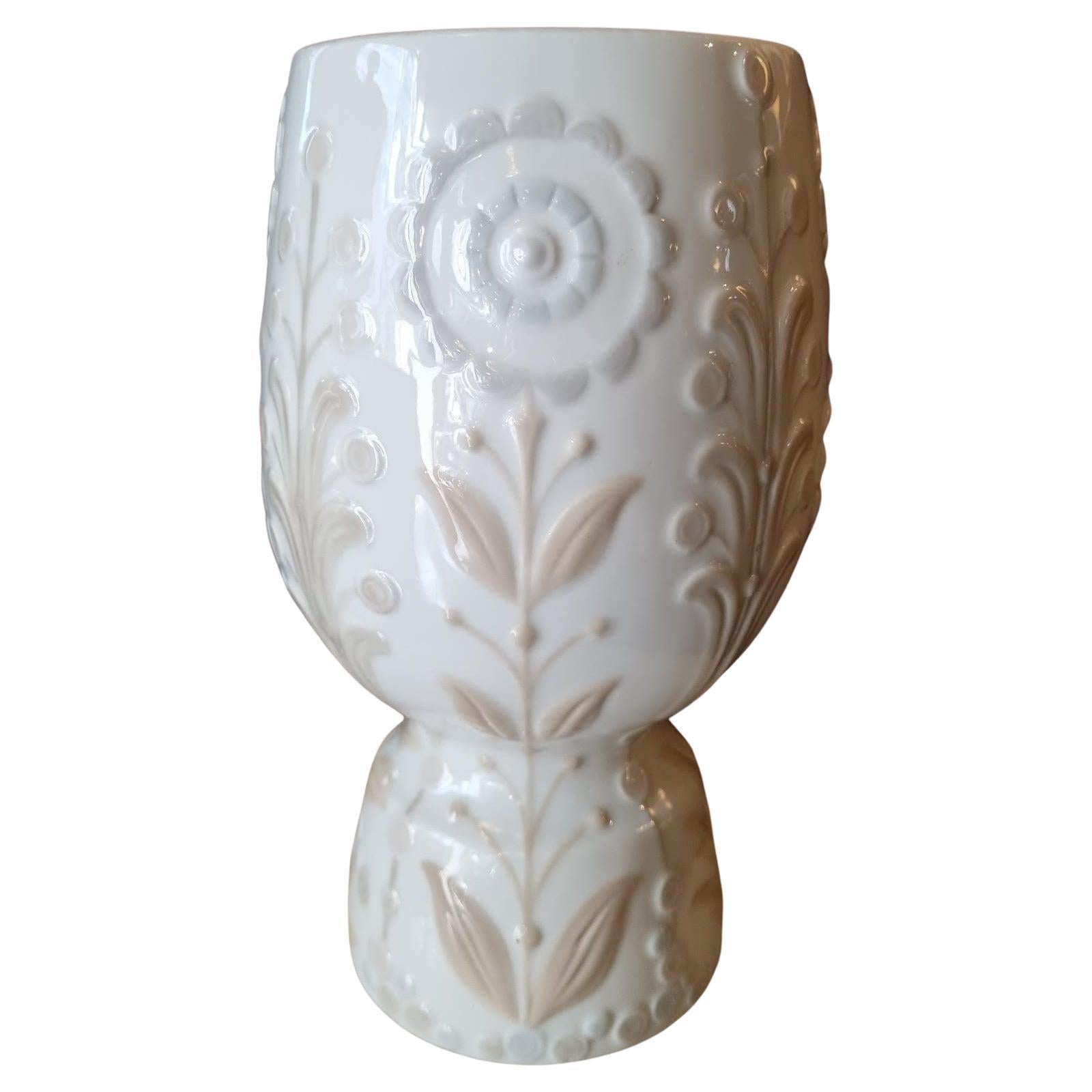 A beautiful porcelain floral vase designed by Julio Fernández and manufactured by Lladró. Spain, 1970s.
This elegant glazed porcelain vase has a clean design with floral and foliage decorations in pastel colors.
Mint condition.
It has the mark of