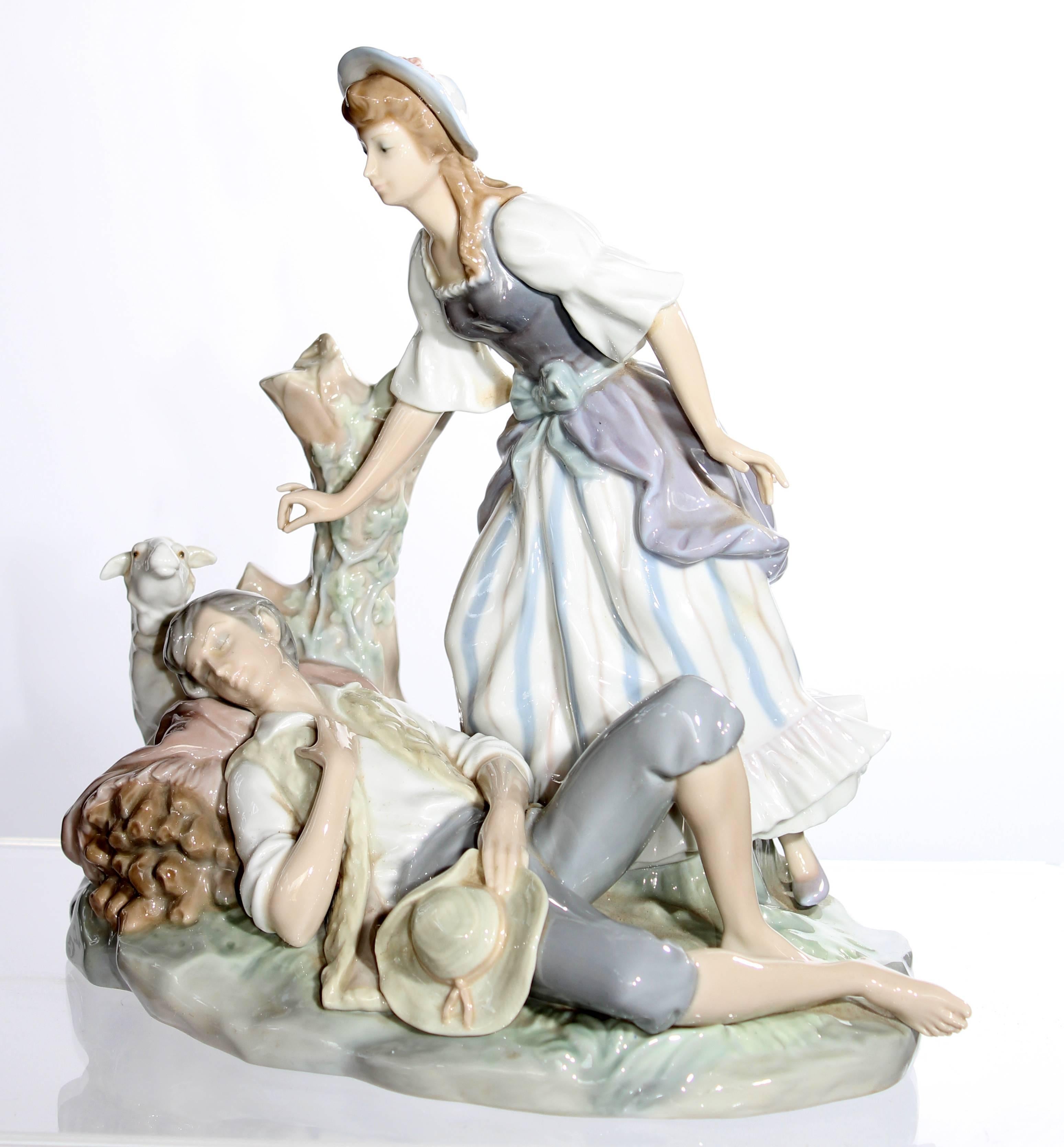 Lladro porcelain sculpture representing a woman leaning over a sleeping man with sheep.