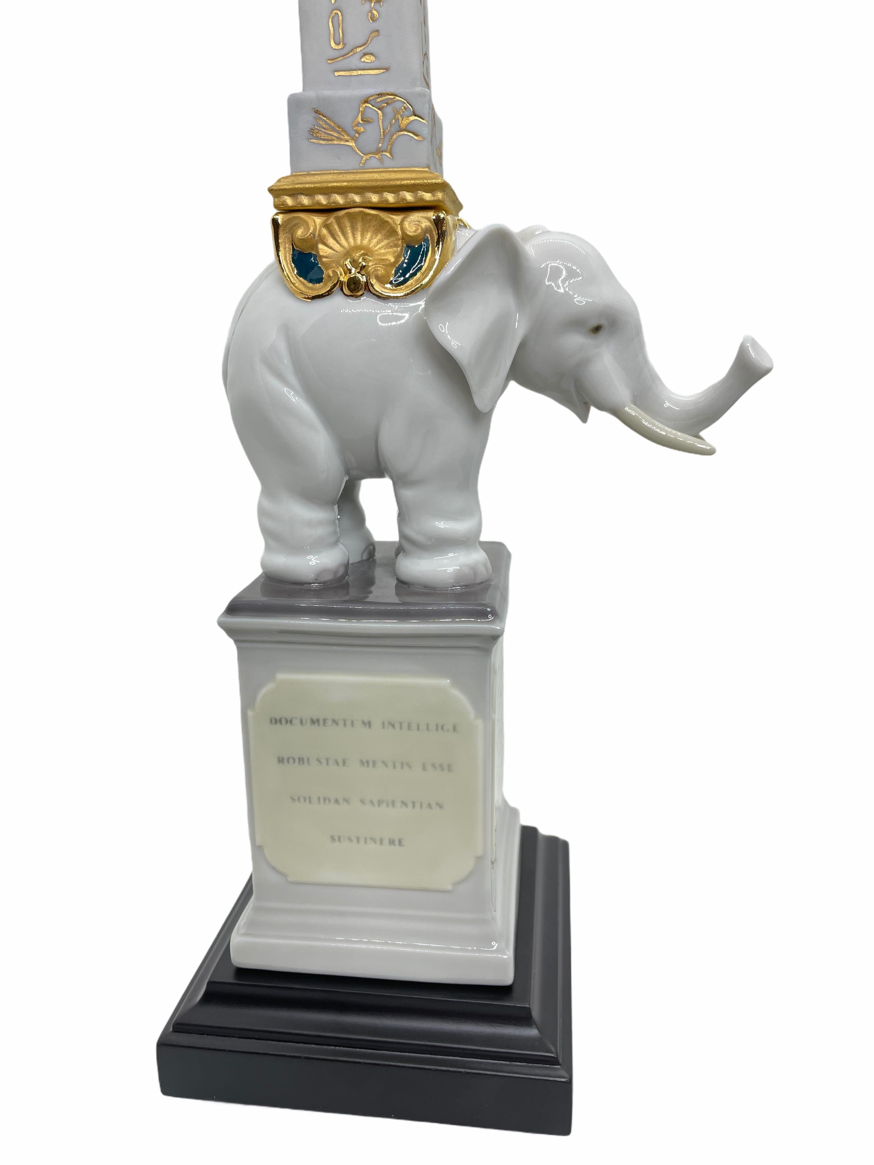 Pulcino obelisk porcelain elephant figurine designed by Sculptor Francisco Cuesta at Lladro Porcelain, Spain. The Lladro Figurines are hand crafted by artisans based in the “City of Porcelain” in Valencia, Spain. They use the finest porcelain