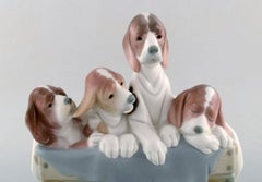 Lladro, Spain, Large Figure in Glazed Porcelain, Four Puppies in a Basket, 1980s