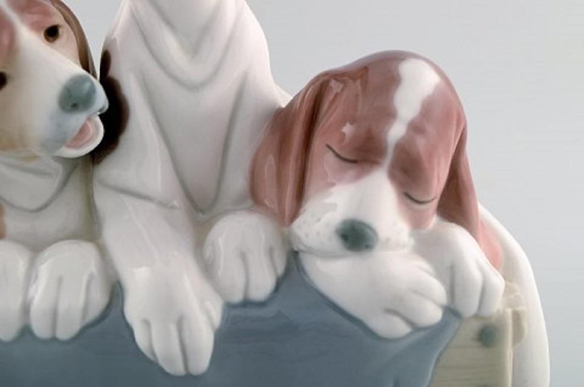 Late 20th Century Lladro, Spain, Large Figure in Glazed Porcelain, Four Puppies in a Basket, 1980s