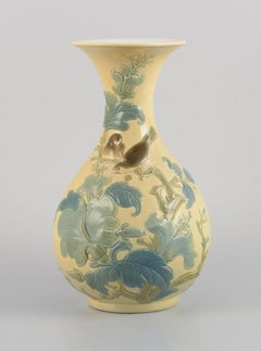 Lladro, Spain, large porcelain vase with flowers and birds in relief.
