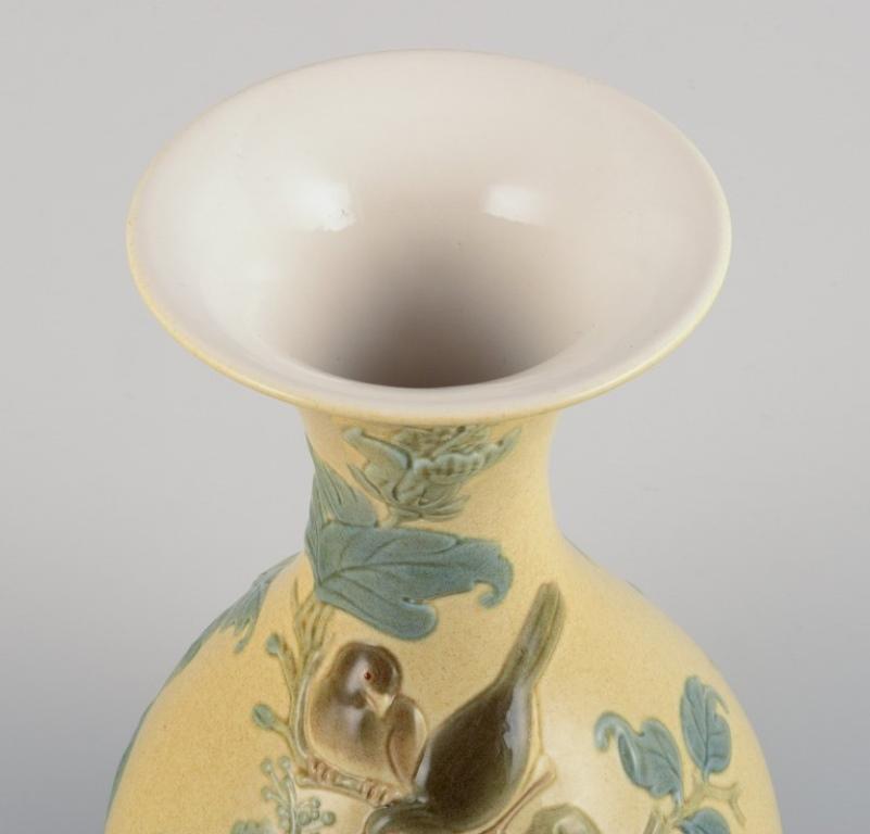 Late 20th Century Lladro, Spain, large porcelain vase with flowers and birds in relief. 